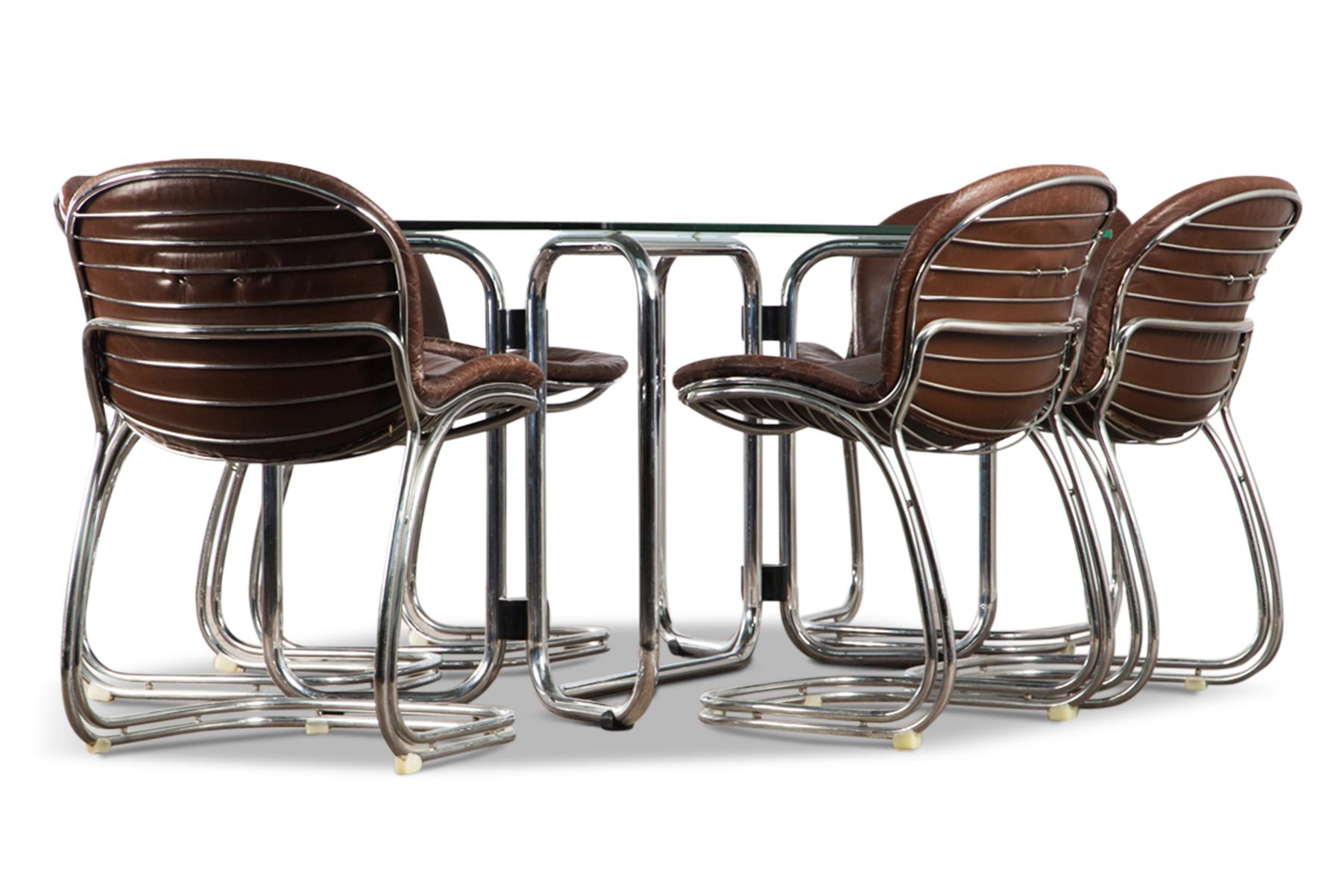 Origin: Denmark
Designer: Gastone Rinaldi
Manufacturer: Rima Mode
Era: 1970s
Materials: Chrome, glass, leather
Measurements: Table – 70.75 long x 36.5 wide x 29 tall chairs- 24.5 wide x 19.75 deep x x32 tall

Condition: In good original