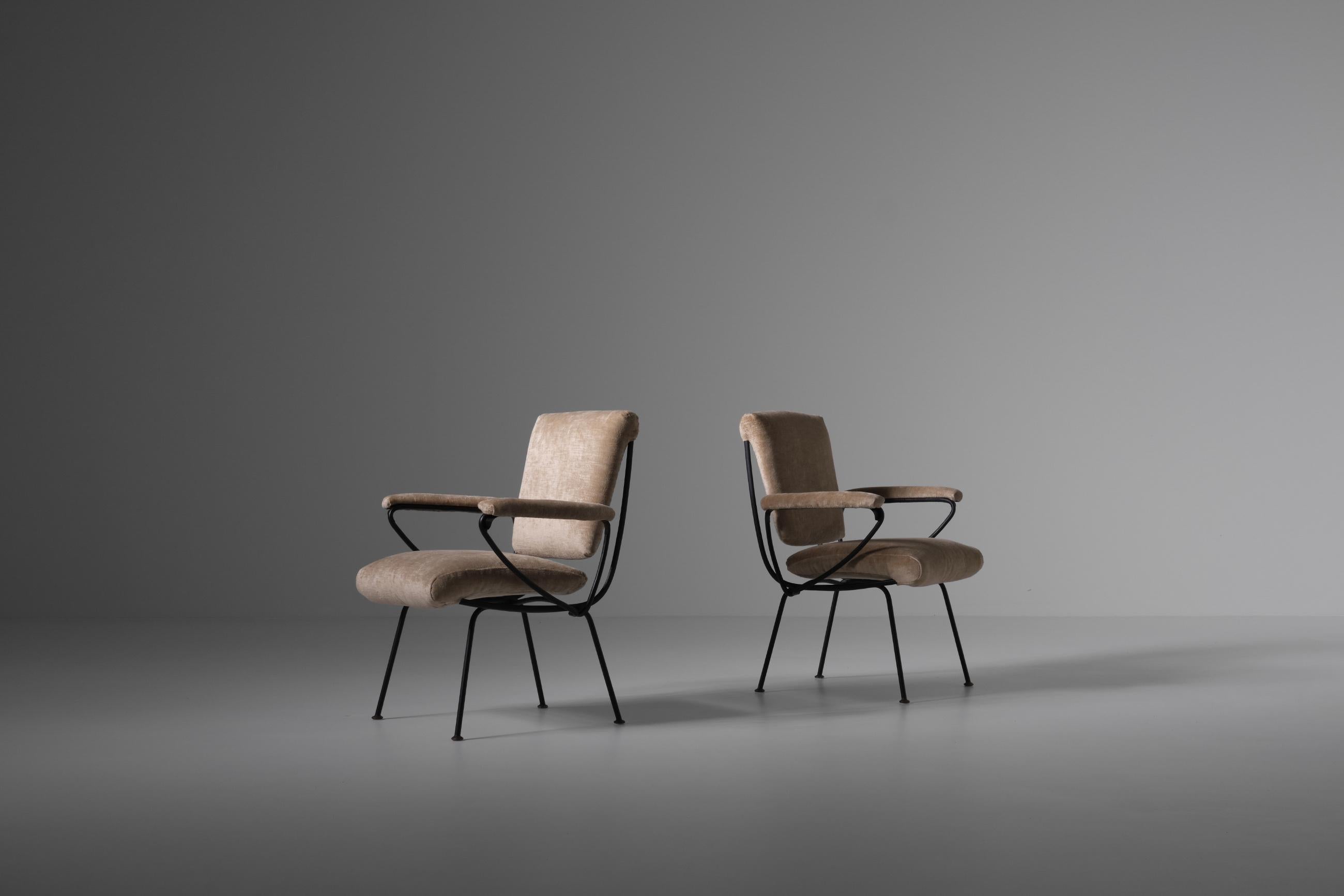 Pair of armchairs model 'DU 24' by Gastone Rinaldi for Rima, Italy 1956. The tubular framing immediately catches the eye and is the signature for this design. The whole frame is made of metal, the seating has a webbing of Pirelli rubber straps. The