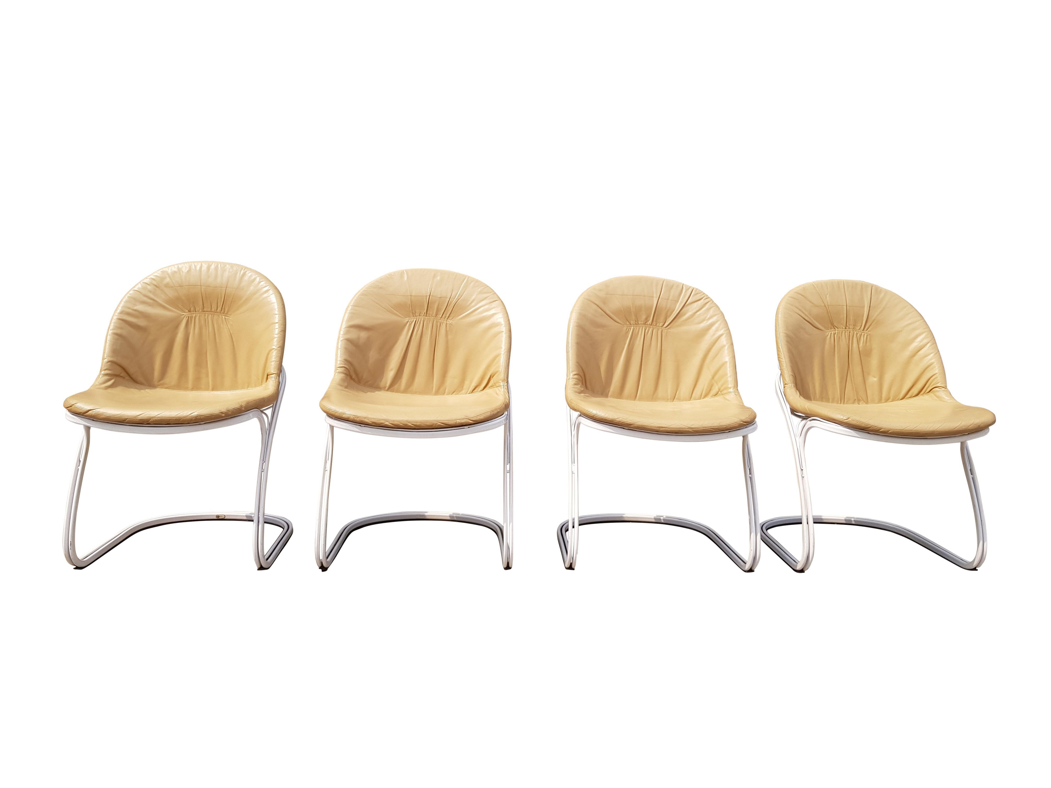 This set of four chairs, model Sabrina, was designed by Gastone Rinaldi for Rima in Padova, Italy during the 1970s. The cantilevered design features a white tubular steel frame and cushions covered with cream leatherette
This set of four chairs are