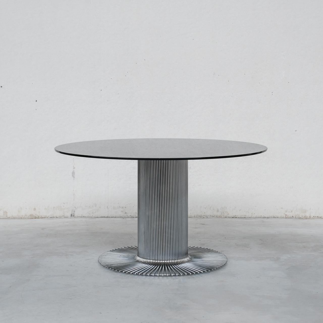 A space age style dining table by Gastone Rinaldi for Rima. 

Italy, c1970s. 

Smoked glass top remains in good condition but there are surface scratches present. 

Good vintage condition. 

PRICES ARE EXCLUSIVE OF VAT IF SOLD IN THE UK. 

Location: