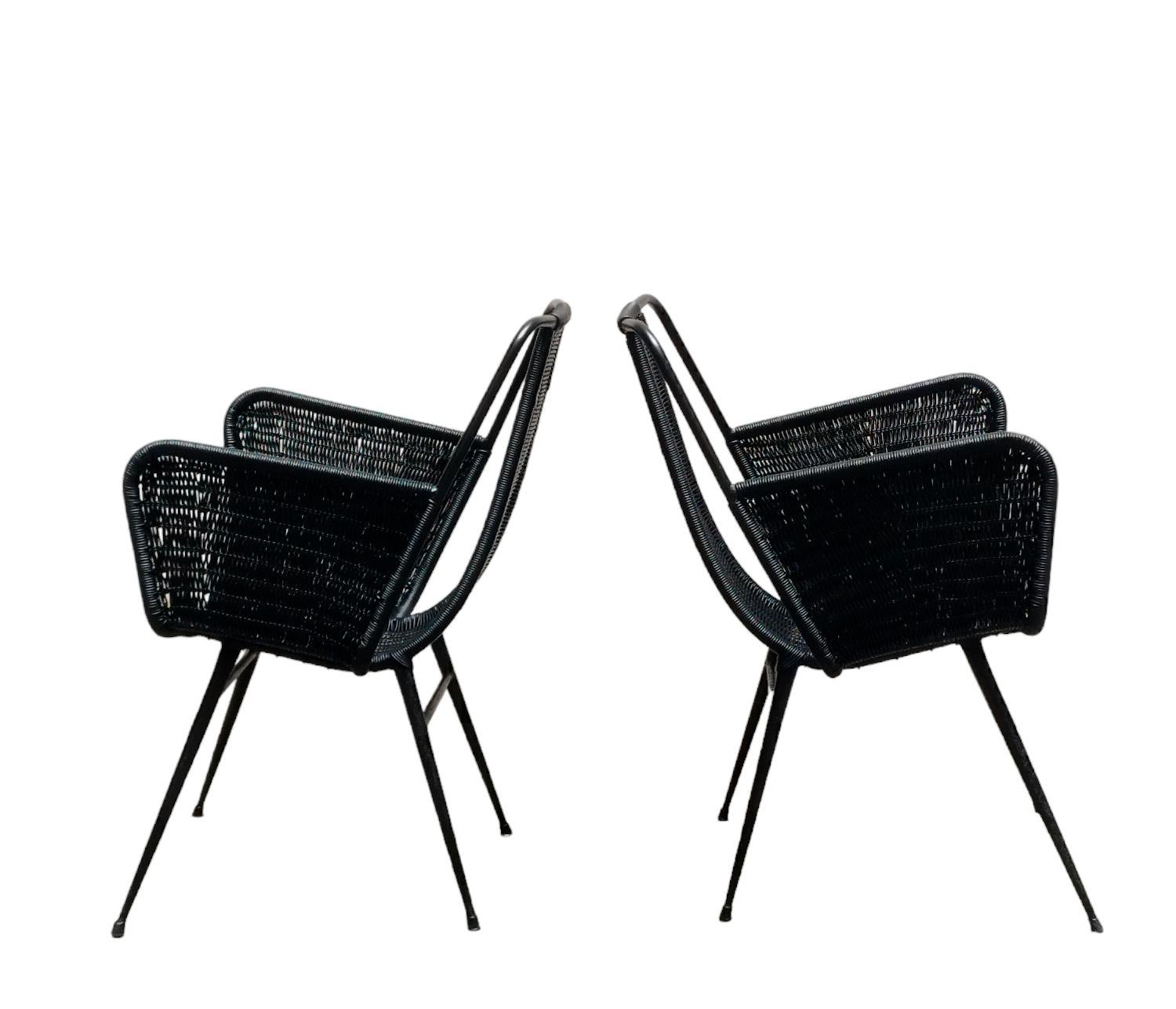 Pair of Outdoor Armchairs in black woven plastic, Designer Gastone Rinaldi, Production Rima, Italy circa 1960. The chairs have been repainted.