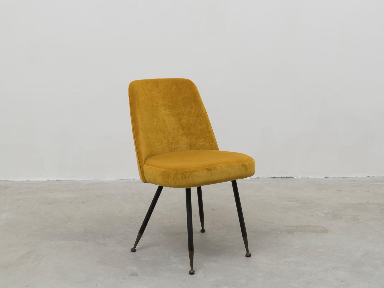 This desk chair was designed in the 1950s by Gastone Rinaldi for Rima, the manufacturer he founded in Brescia. 
Newly upholstered in golden velvet, while legs and feet are left with their original patina. 
Published on Roberto Aloi's book 