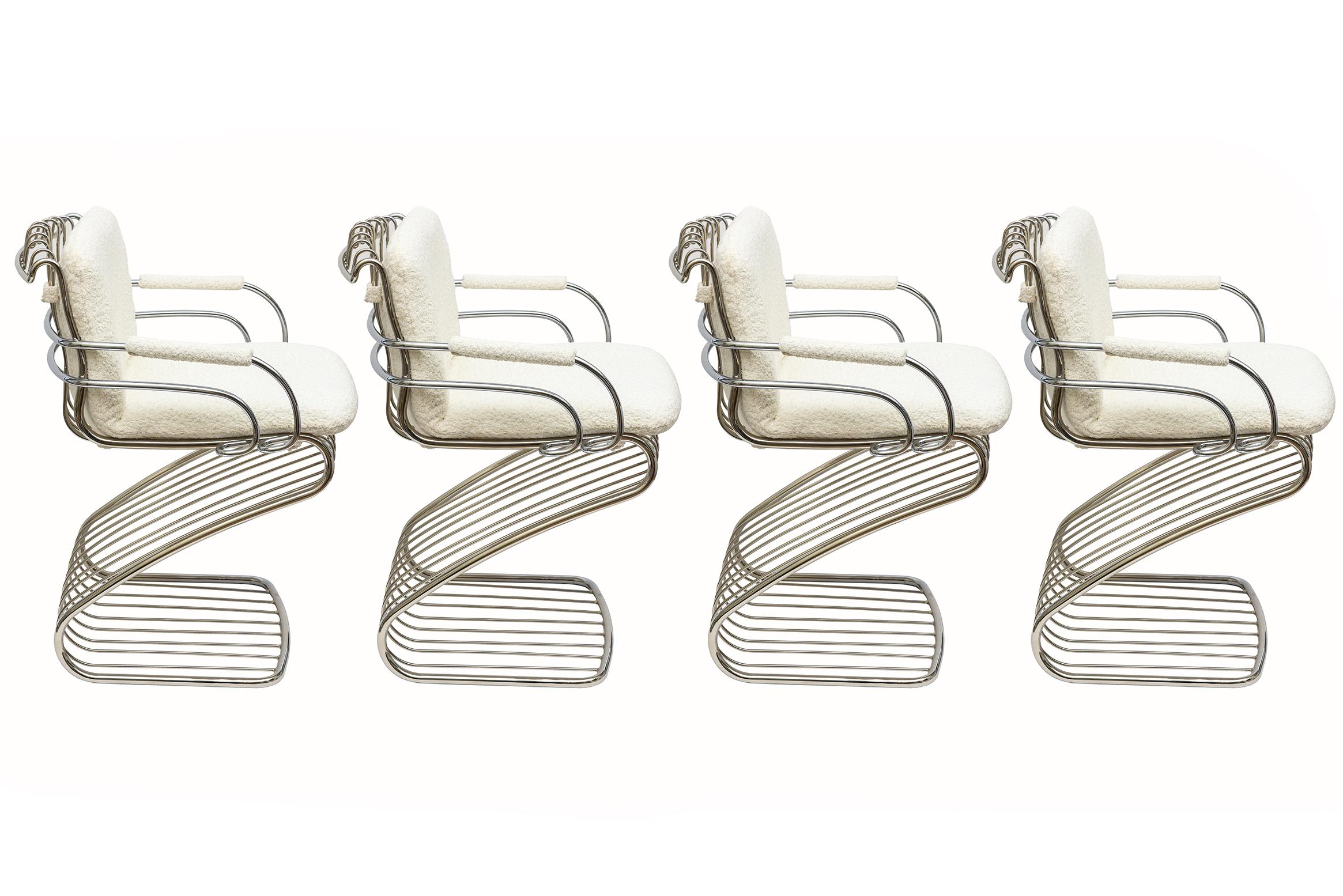 This vintage set of 4 fully restored modernsist rare Italian Gastone Rinaldi dining chairs for Rima cantilever. These are from the 70's. They have a unique fluid form of tubular curved bars that are very sculptural in their entity and angles. They