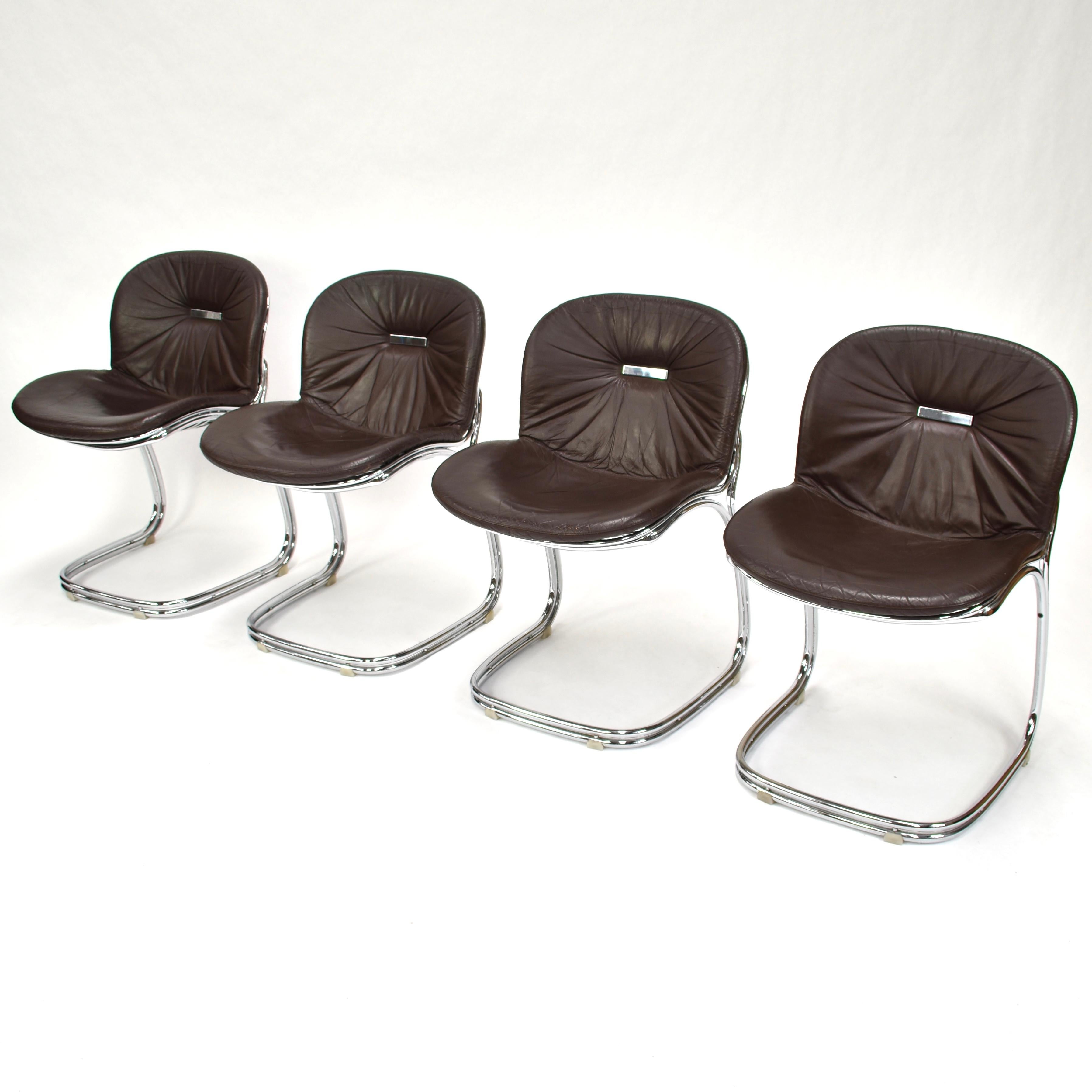 Set of four chocolate brown leather dining chairs by Gastone Rinaldi for RIMA, Italy, 1970s.
These chairs still remain in a very good (excellent) condition.

Manufacturer: RIMA

Designer: Gastone Rinaldi

Model: Sabrina dining