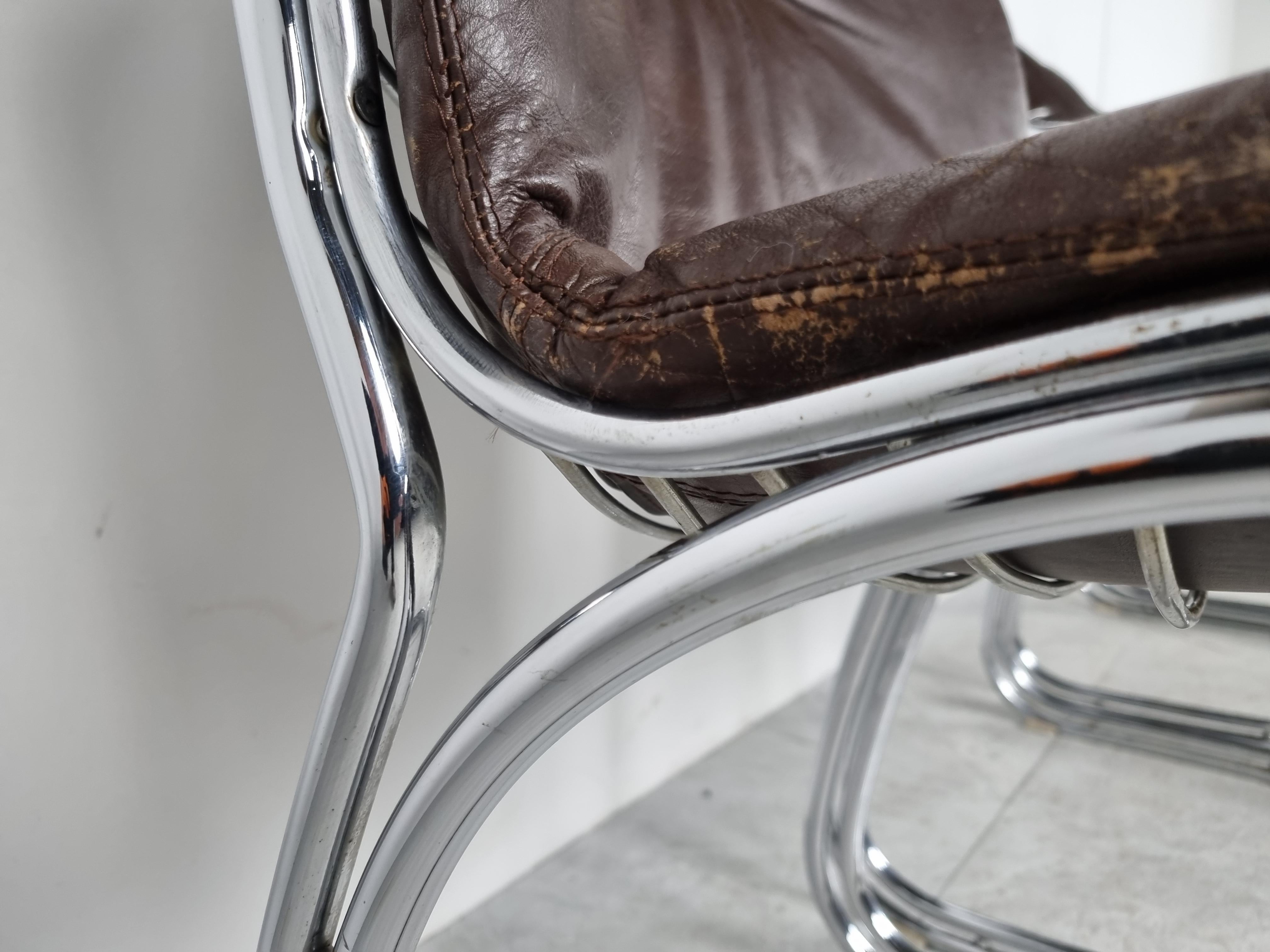 Vintage dining room chairs model 'sabrina' by Gastone Rinaldi for Rima Italy.

The set consists of 4 chairs with their original brown leather cushions.

Beautiful timeless design.

The chrome is in good condition, the leather is still comfortable,