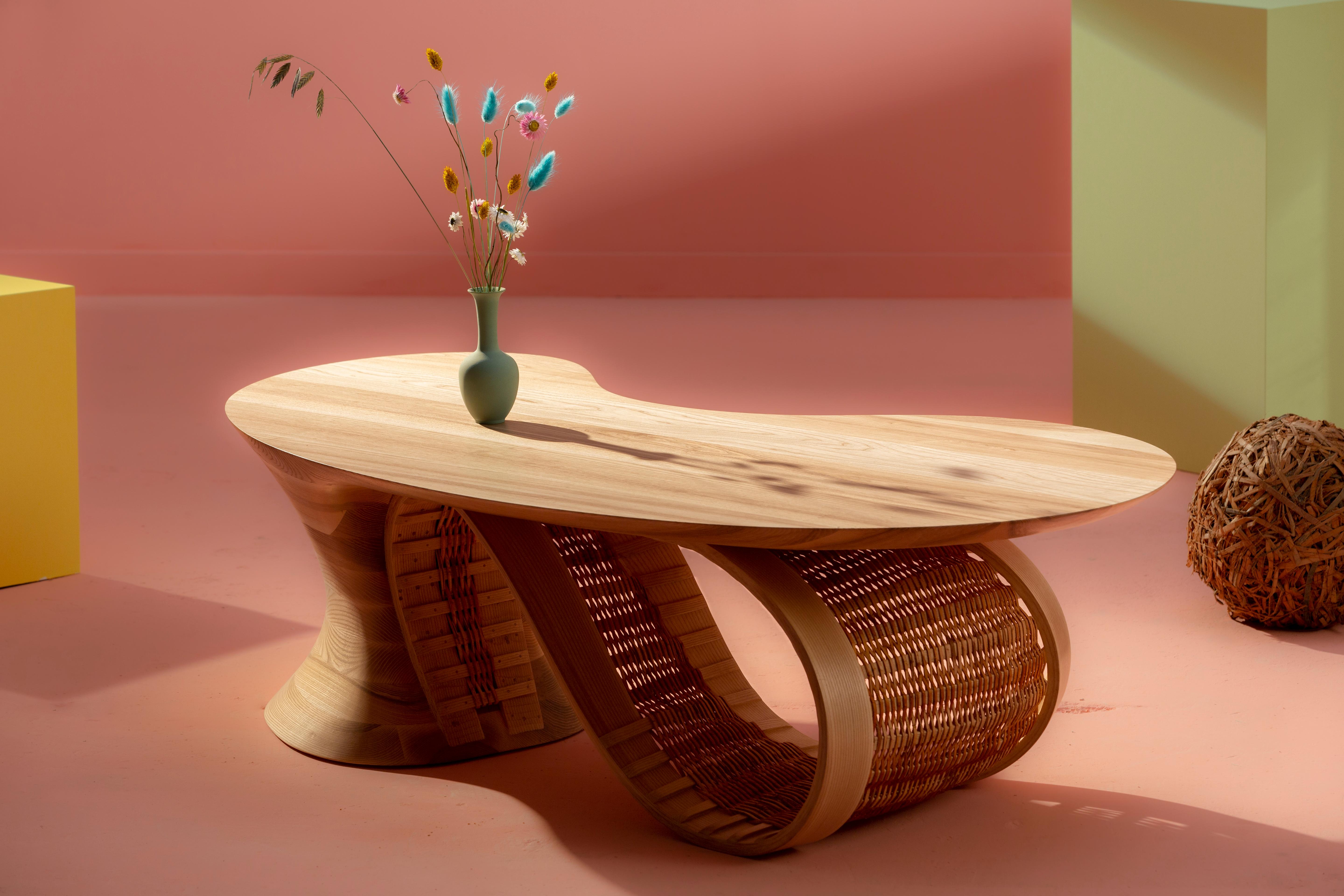 Dylan Moore Studio's Gather Table is a stunning example of the studio's commitment to creating functional furniture that is as much a work of art as it is a practical piece. The Gather Table is an intricately crafted piece of furniture that