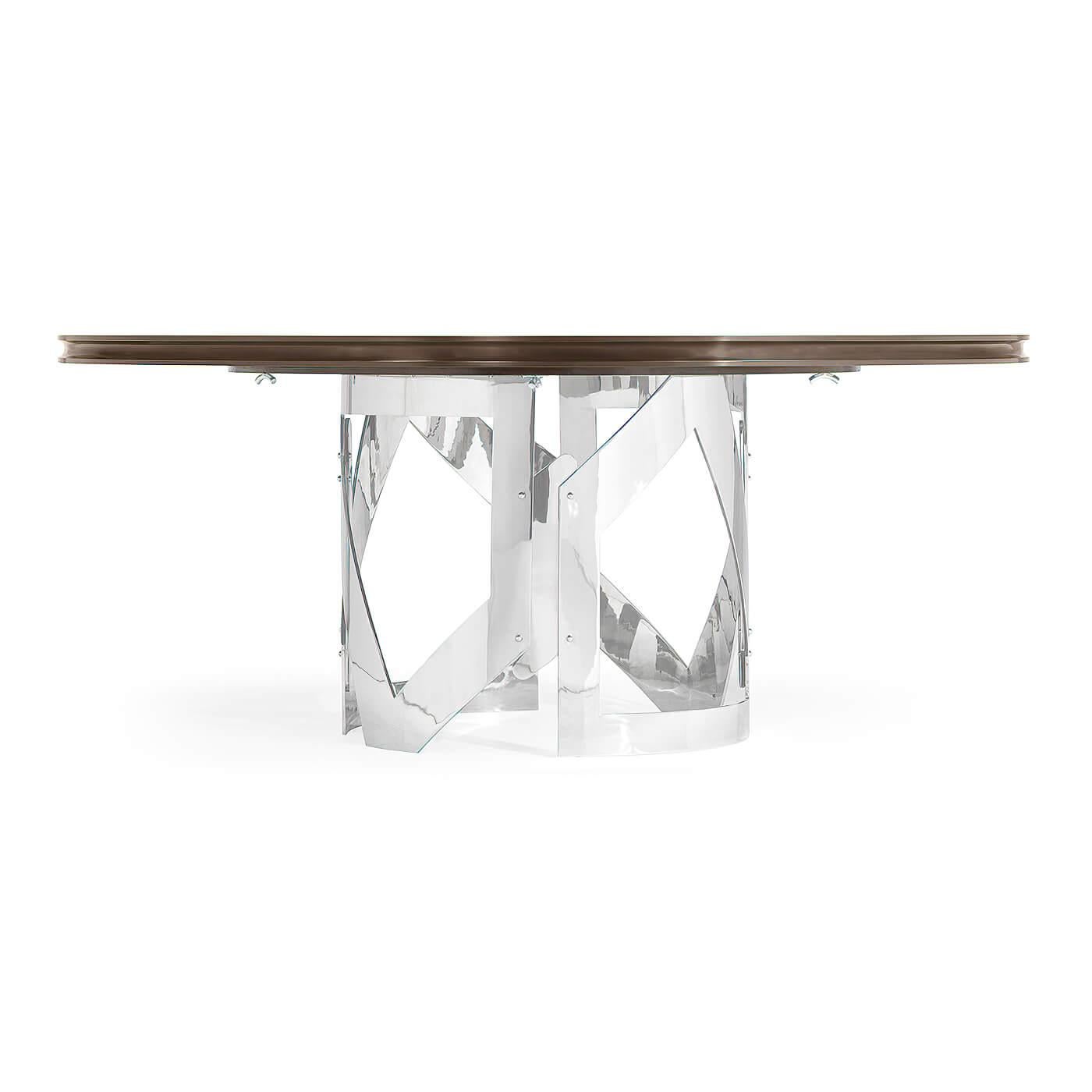 An Art Deco-inspired round dining table with an unusual Eucalyptus veneered top raised on an unusual openwork stainless steel column base. 

Dimensions: 60