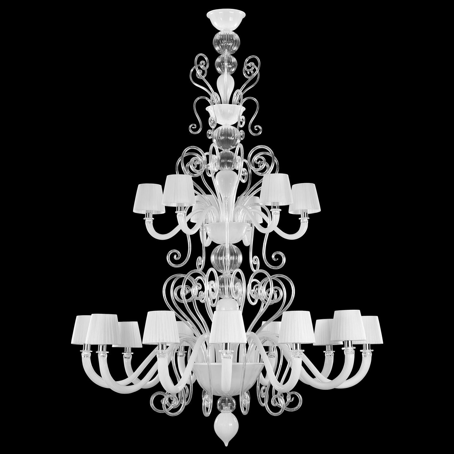 Gatsby Chandelier 12+6 lights. White and crystal Murano glass. White lampshades by Multiforme

 The Venetian chandelier Gatsby is the perfect combination of elegant and modern elements. The use of colour featuring bright tones, the surface with