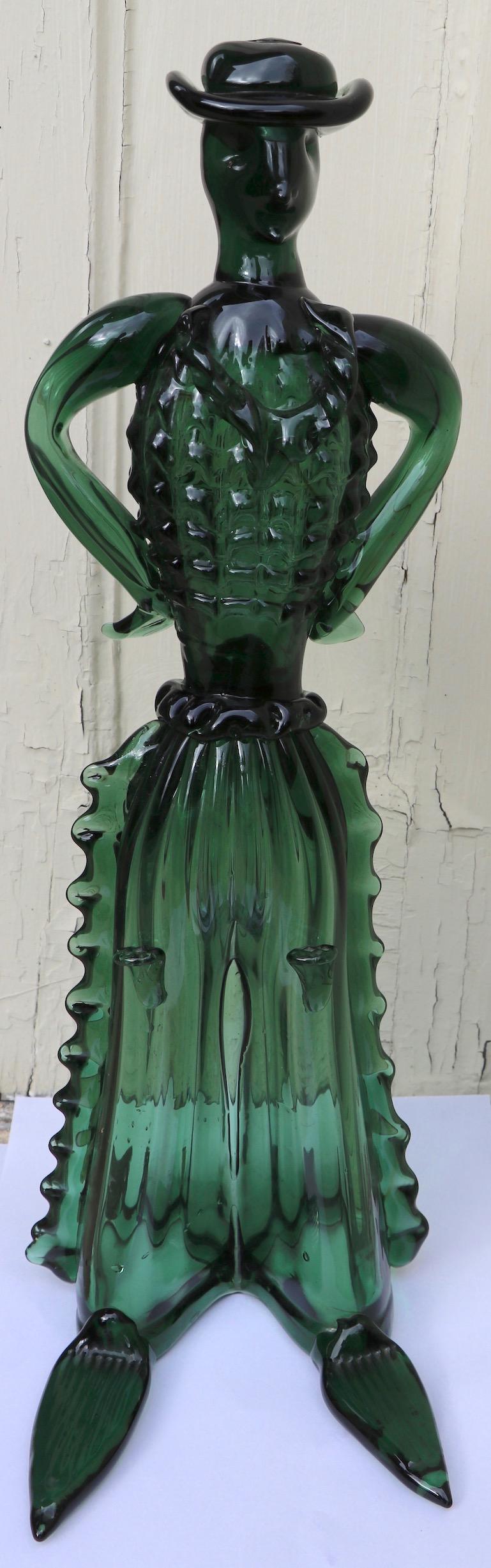Italian made figure of Spanish cowboy in emerald glass, attributed to Barovier Seguso Farro, unsigned. In perfect condition, free of chips, cracks, damage or repairs. Playful example of midcentury Murano glass, well executed with difficult