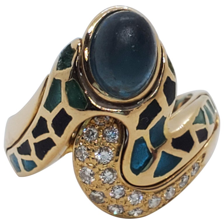 Gaudi Blue Topaz Oval Cabochon and White Diamond Ring in 18 Karat Yellow  Gold For Sale at 1stDibs | gaudi inspired rings, gaudi ring, gaudi crystal