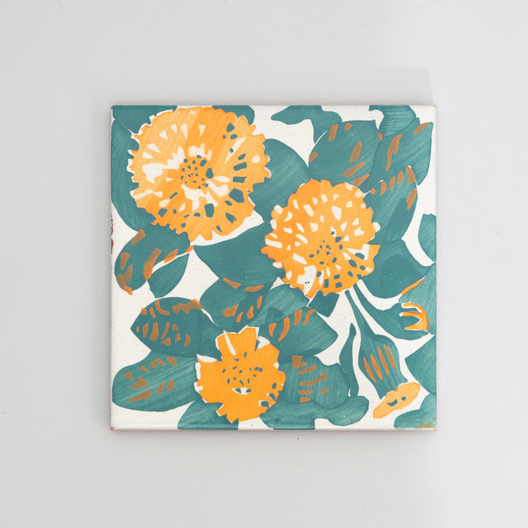 Elevate your space with a modern reproduction of Antoni Gaudi's decorative ceramic tile, inspired by the enchanting marigold and dianthus motifs from the iconic facade of Casa Vicens. Gaudi's distinctive style, influenced by his passions for