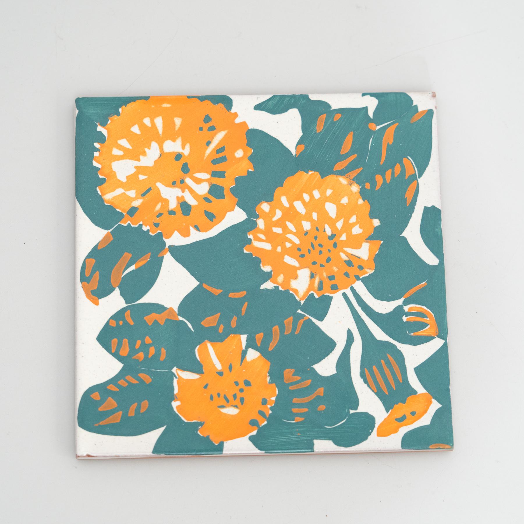 Elevate your space with a modern reproduction of Antoni Gaudi's decorative ceramic tile, inspired by the enchanting marigold and dianthus motifs from the iconic facade of Casa Vicens. Gaudi's distinctive style, influenced by his passions for
