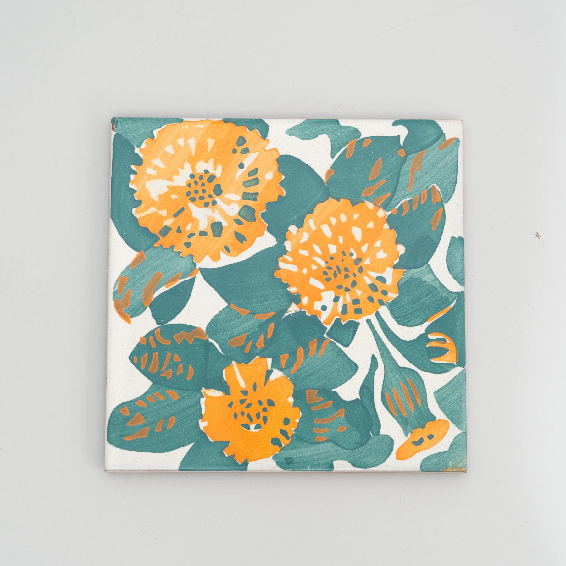 Elevate your decor with this enchanting set of two modern reproductions of Antoni Gaudi's decorative ceramic tiles, inspired by the captivating marigold and dianthus motifs adorning the iconic facade of Casa Vicens. Crafted with meticulous attention