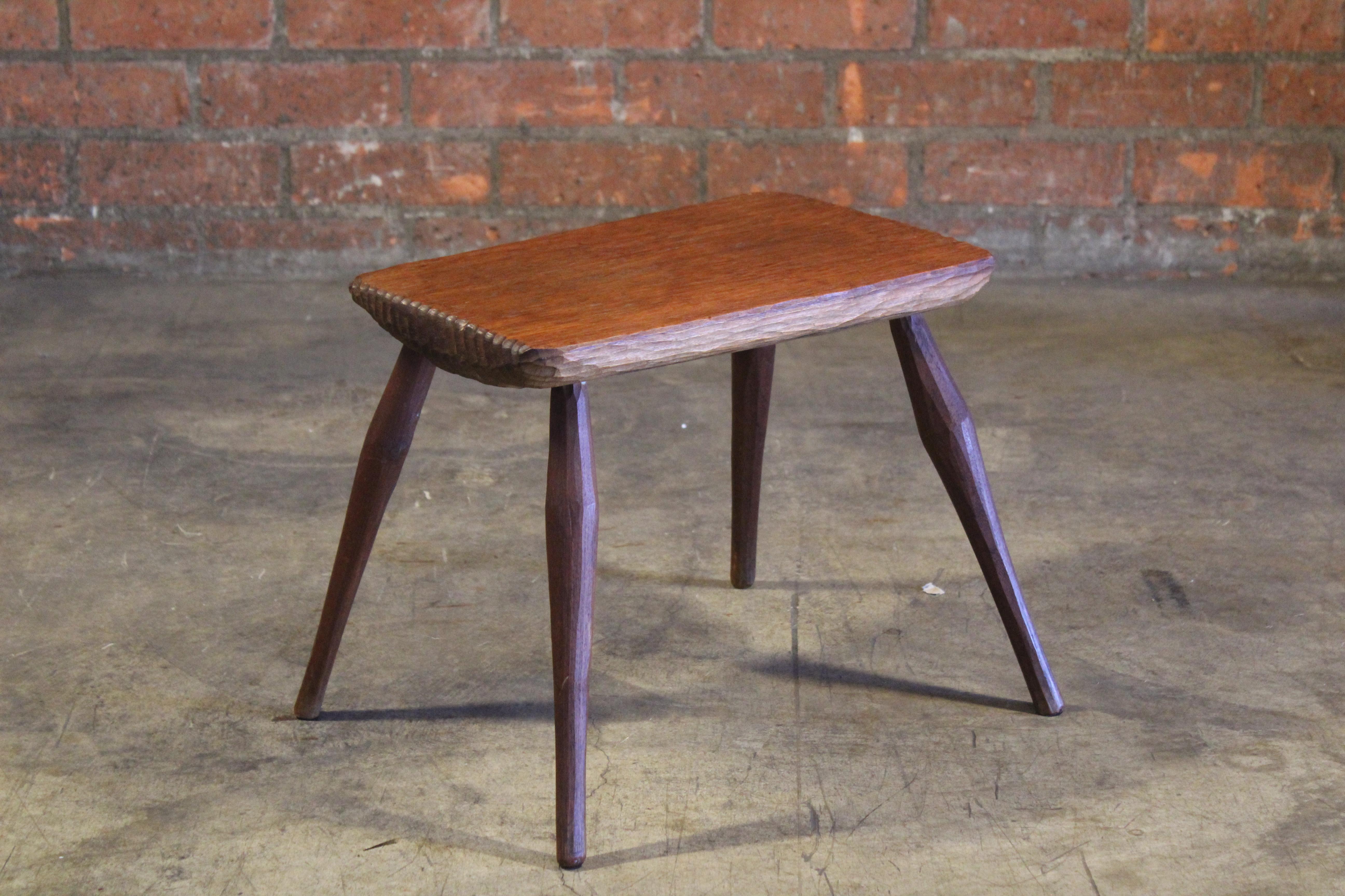 A vintage 1960s gauged oak side table attributed to Jean Touret for Atelier Marolles, France.