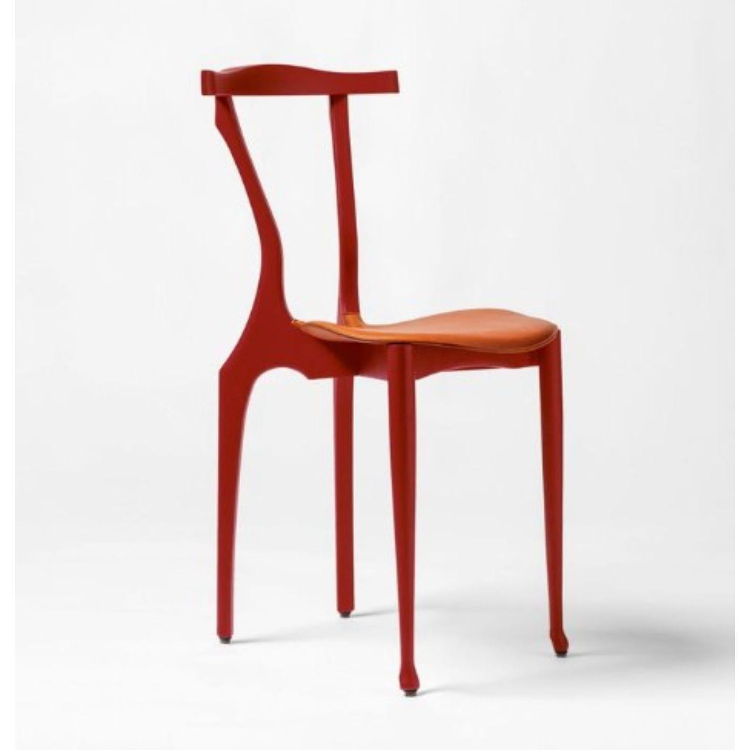Gaulinetta coral red chair by Oscar Tusquets
Dimensions: D40 x W52 x H 83 cm.
Materials: ash wood

The Gaulino chair was designed in 1987. BD re-edited it, improving it in 2010. It’s probably one of the best designs by Oscar Tusquets. Even