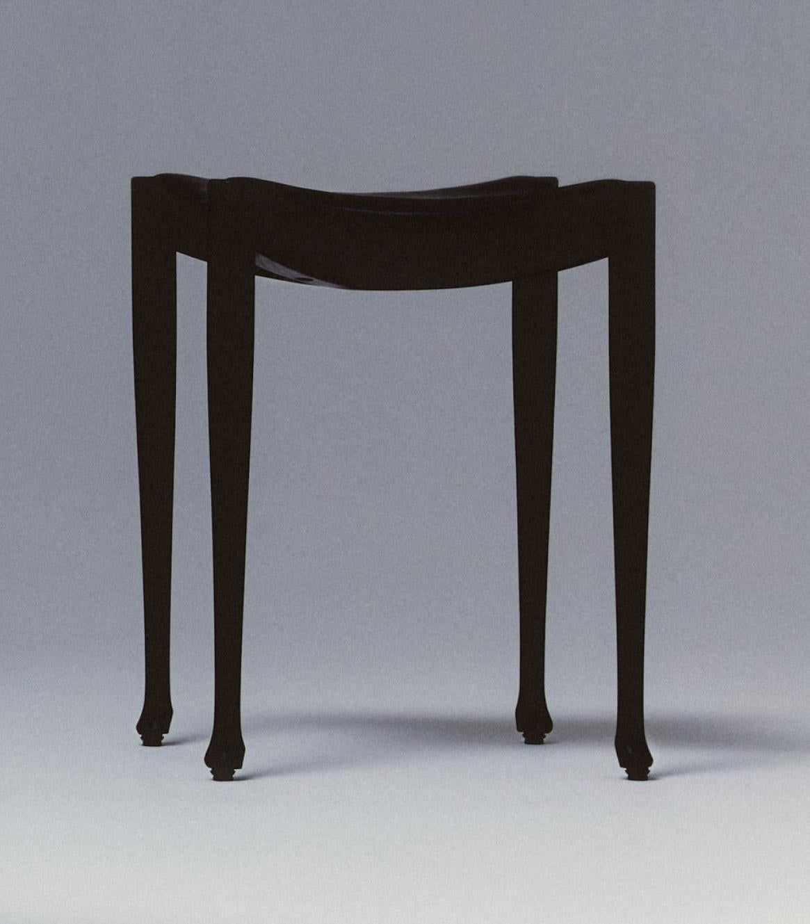 Gaulino Stool by Oscar Tusquets
Dimensions: Ø 50 x H 46 cm.
Materials: Solid stained black ash and black hide.

Frame in natural varnished solid ash, ash stained black or coral red. Seat upholstered in natural hide, black hide or toasted hide.