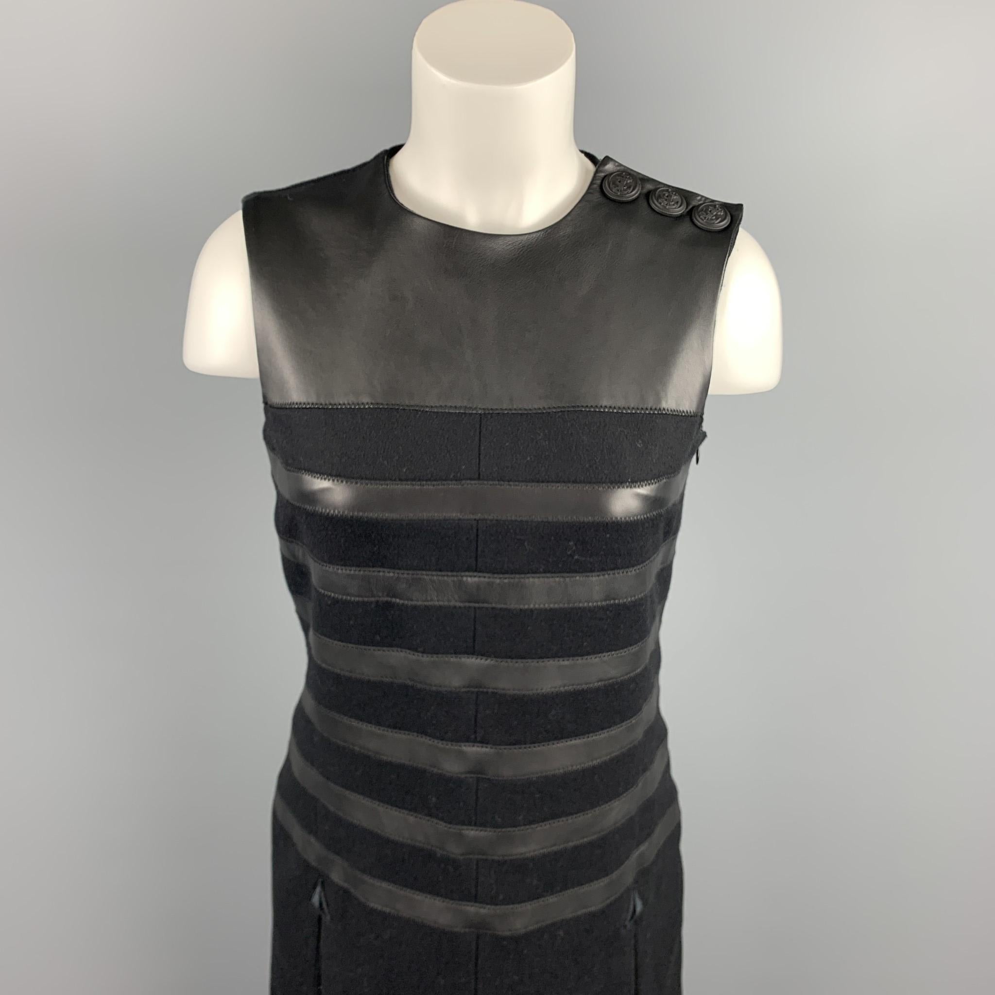 GAULTIER 2 dress comes in a black virgin wool featuring a shift style, leather trim, slit pockets, front & back slits, three detail, and a side zipper closure. Made in Italy.

Excellent Pre-Owned Condition.
Marked:

Measurements:

Shoulder: 13.5 in.