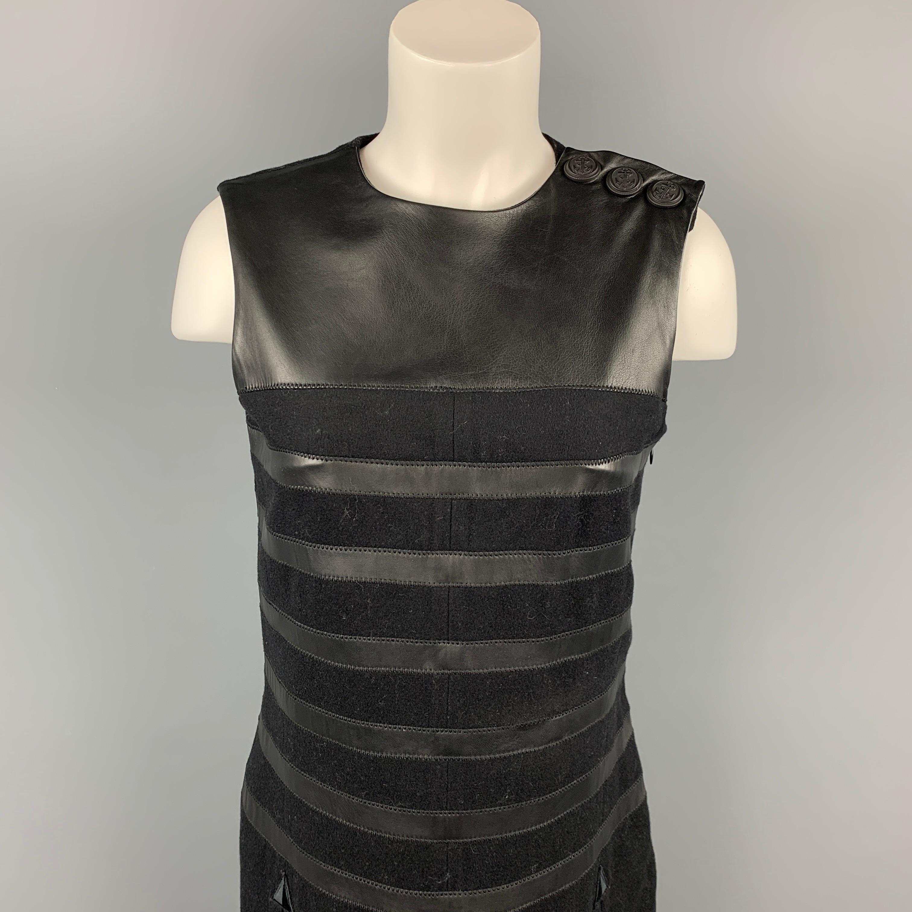 GAULTIER 2 dress comes in a black virgin wool featuring a shift style, leather trim, slit pockets, front & back slits, three detail, and a side zipper closure. Made in Italy.

Very Good Pre-Owned Condition.
Marked: I 42 / D 38 / F 38 / GB 10 / USA