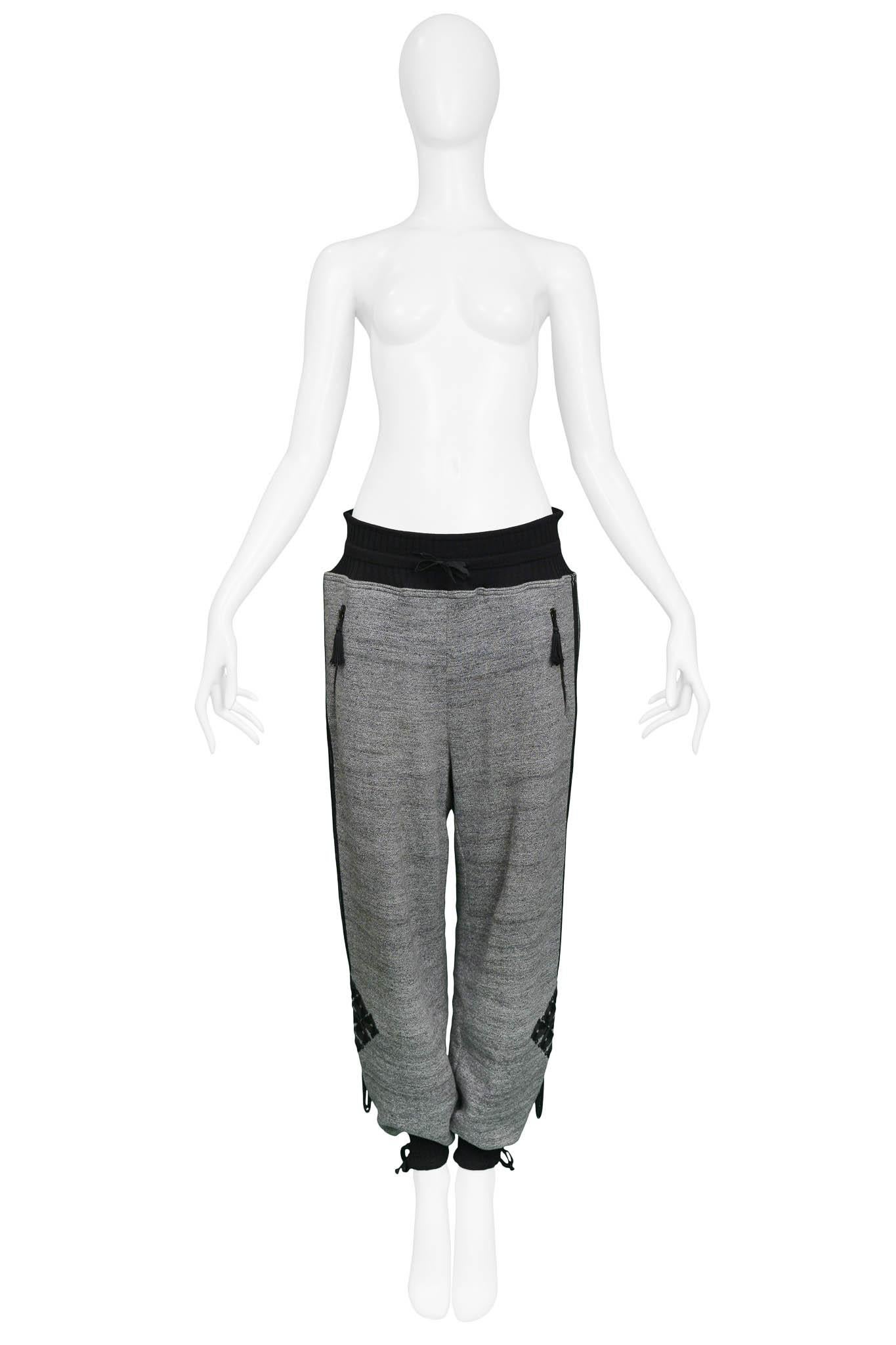 Resurrection Vintage is excited to offer a pair of vintage Jean Paul Gaultier gray sweatpants featuring embroidery on the sides, pockets, a drawstring waistband, and ribbed cuffs with ties.

Jean Paul Gaultier
Size: 40
Cotton and Wool 
2010