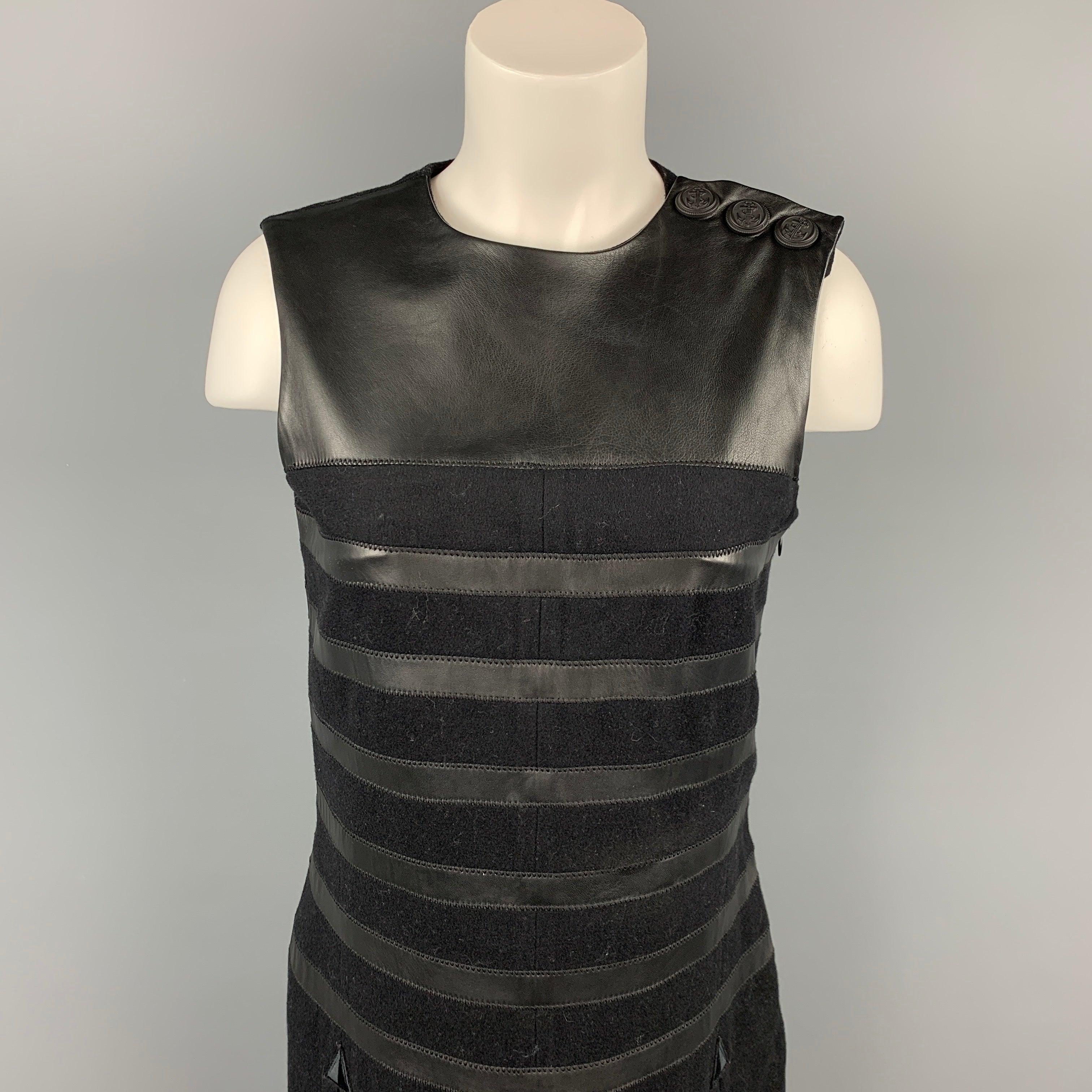 GAULTIER 2 by Jean Paul Gaultier dress comes in a black virgin wool featuring a shift style, leather trim, slit pockets, front & back slits, three detail, and a side zipper closure. Made in Italy.Very Good Pre-Owned Condition. 
 

 Marked:  I 42 / D