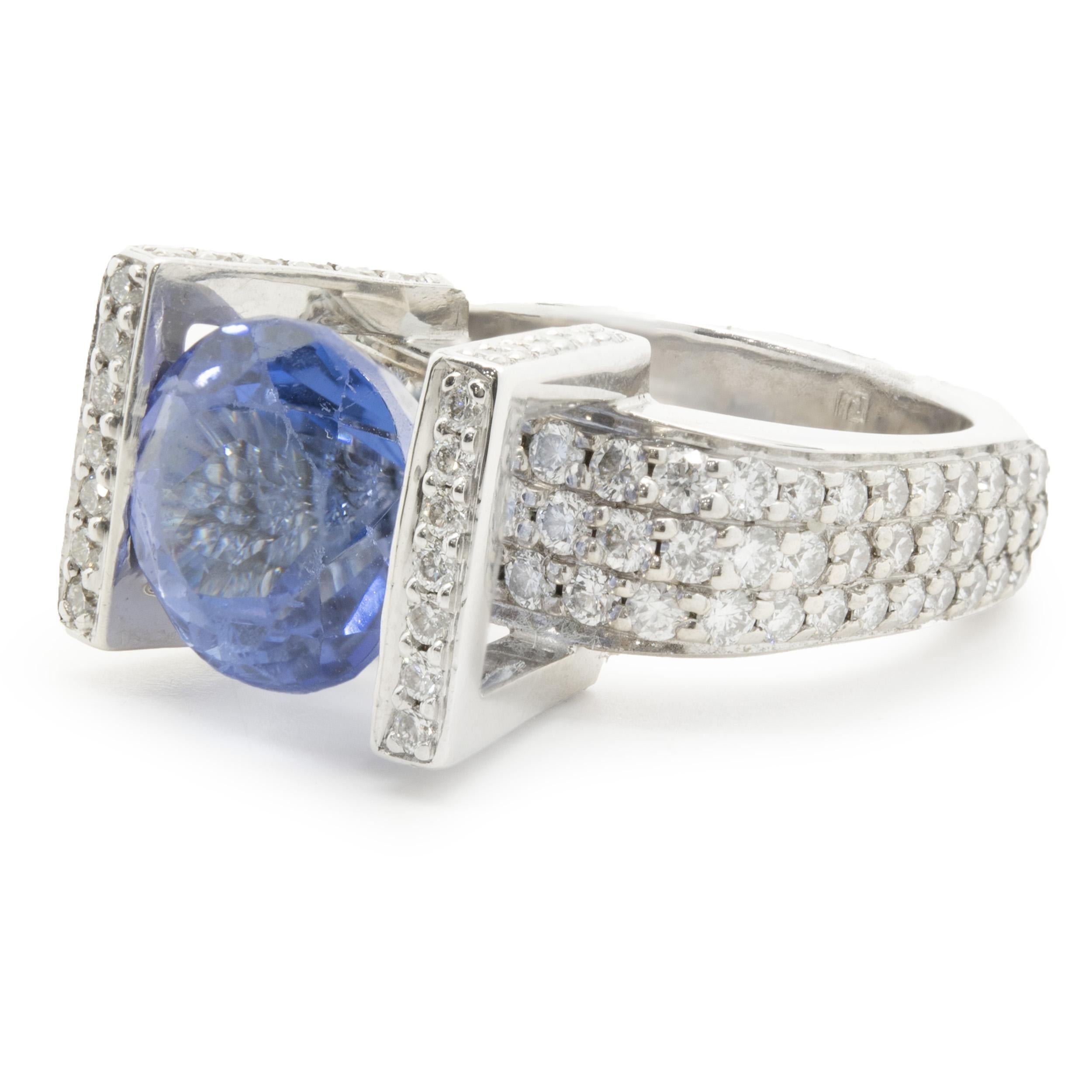 Designer: Gauthier
Material: 14K white gold
Tanzanite: 1 round cut = 5.50ct
Diamond: 117 round brilliant cut = 1.96cttw
Color: F
Clarity: VS1
Dimensions: ring top measures 15.6mm wide
Weight: 15.38 grams
