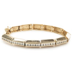 Bracciale in linea Gauthier in oro giallo 14 carati con diamanti incastonati a canale