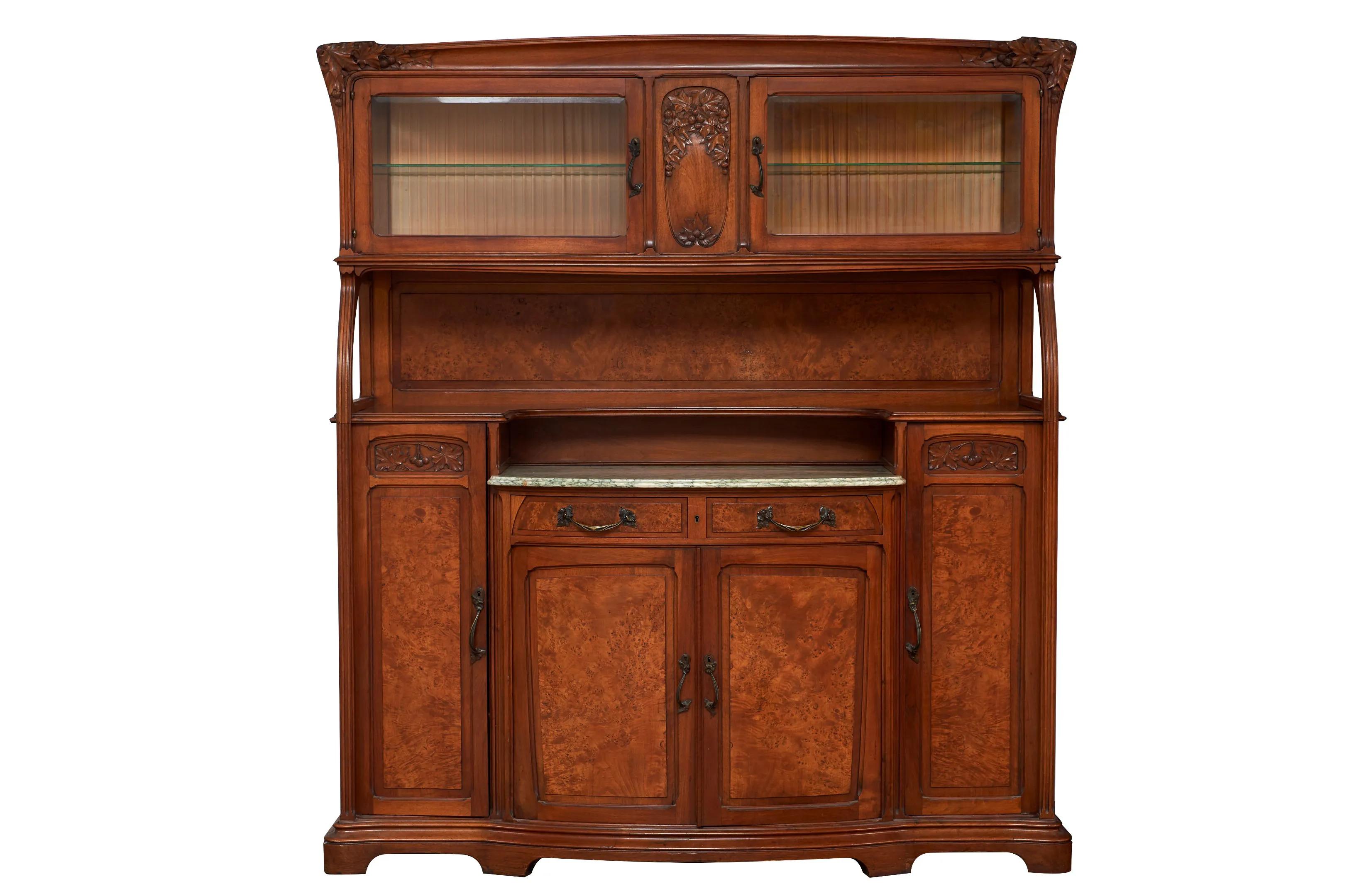 Attributed to GAUTHIER-POINSIGNON & Cie, Dining room furniture in walnut and elm burl veneer decorated with fruits and plane tree leaves (Platanus orientalis) and bronze ornamentation, Art Nouveau period, comprising: - a sideboard two bodies opening
