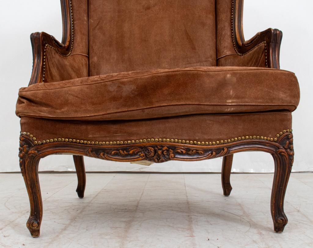 Jacques Alexis Gautier (French, 1695 -1767) Style Louis XV Manner Beechwood Bergere, with brown suede upholstery and carved foliate motif design, upholstery label to underside. 44