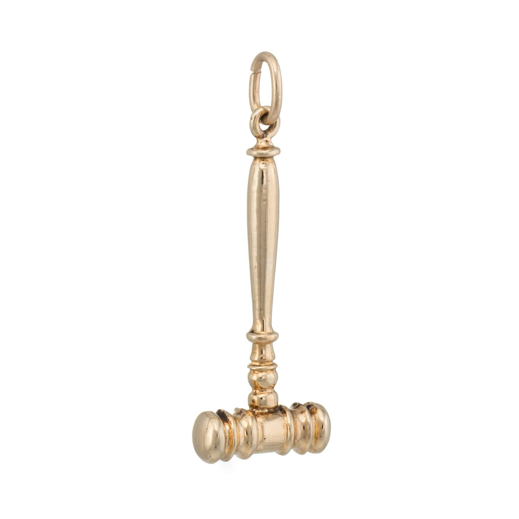 Finely detailed gavel pendant or charm, crafted in 14 karat yellow gold. 

The pendant is in excellent original condition. 

Particulars:

Weight: 4 grams

Stones:  N/A.

Size & Measurements: The pendant measures 1 1/2 inches in length (including