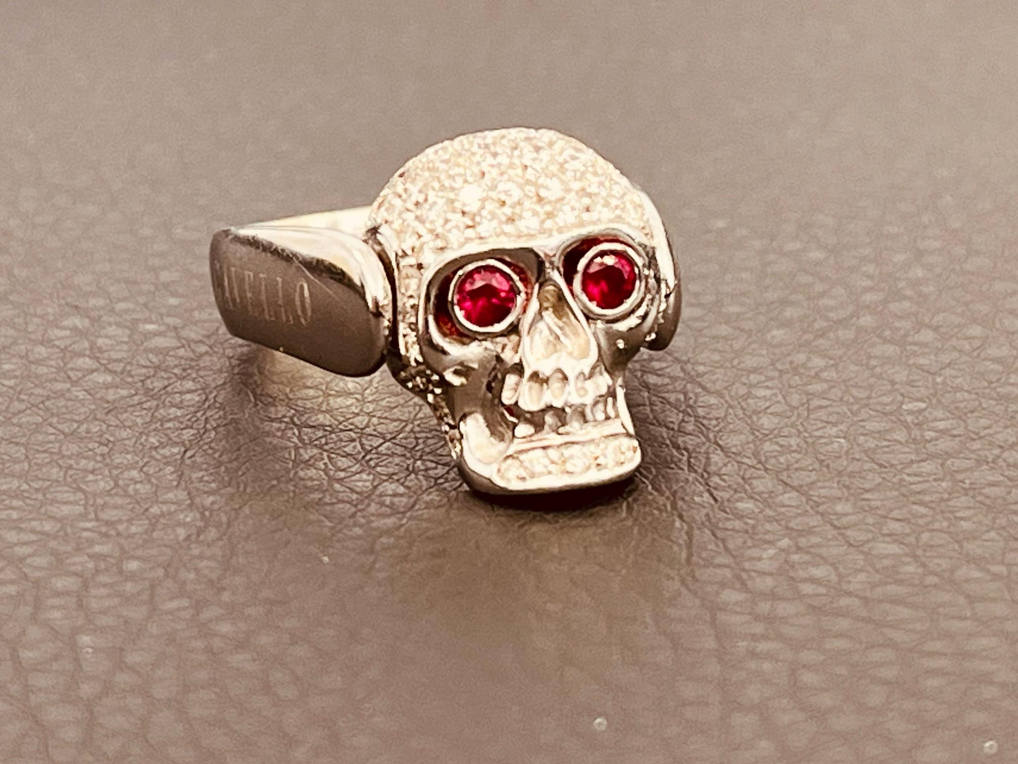 silver skull ring with ruby eyes