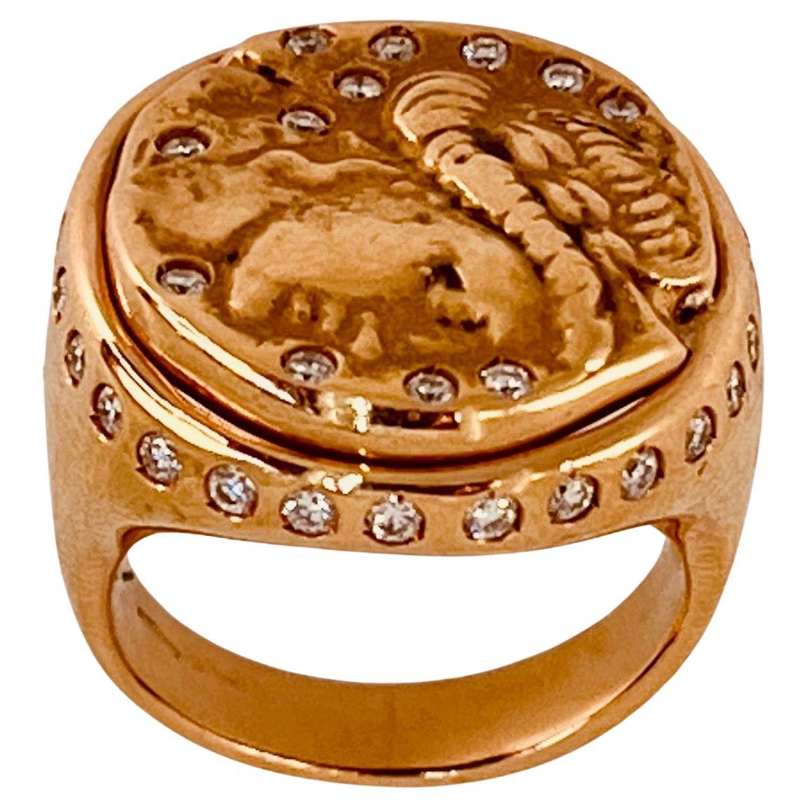 Gavello 18ct gold and diamond ring, centring an image of Alexander The Great with random set diamonds and a line of diamonds set along the bezel. Signet ring, 21mm diameter. Weight: 15.8 grames. Approx. diamond weight: 0.8ct. Ring is resizable. Size