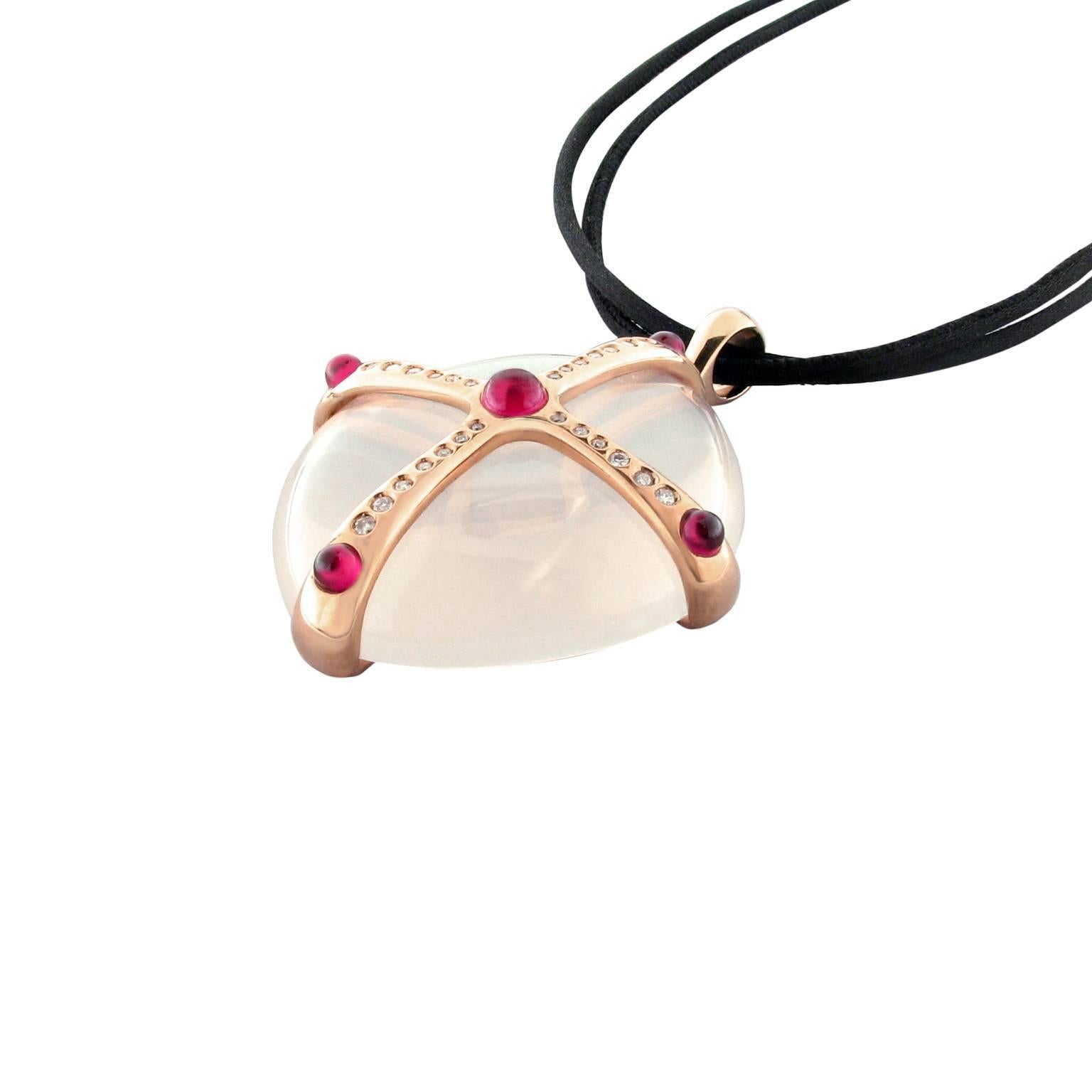 Contemporary sculptured pendant in 18k rose gold. The jewel features a custom cut milky rock crystal with rubies and white diamonds.
Signed and hallmarked Gavello. 
The brand is known for its impeccable craftsmanship and signature sophisticated,