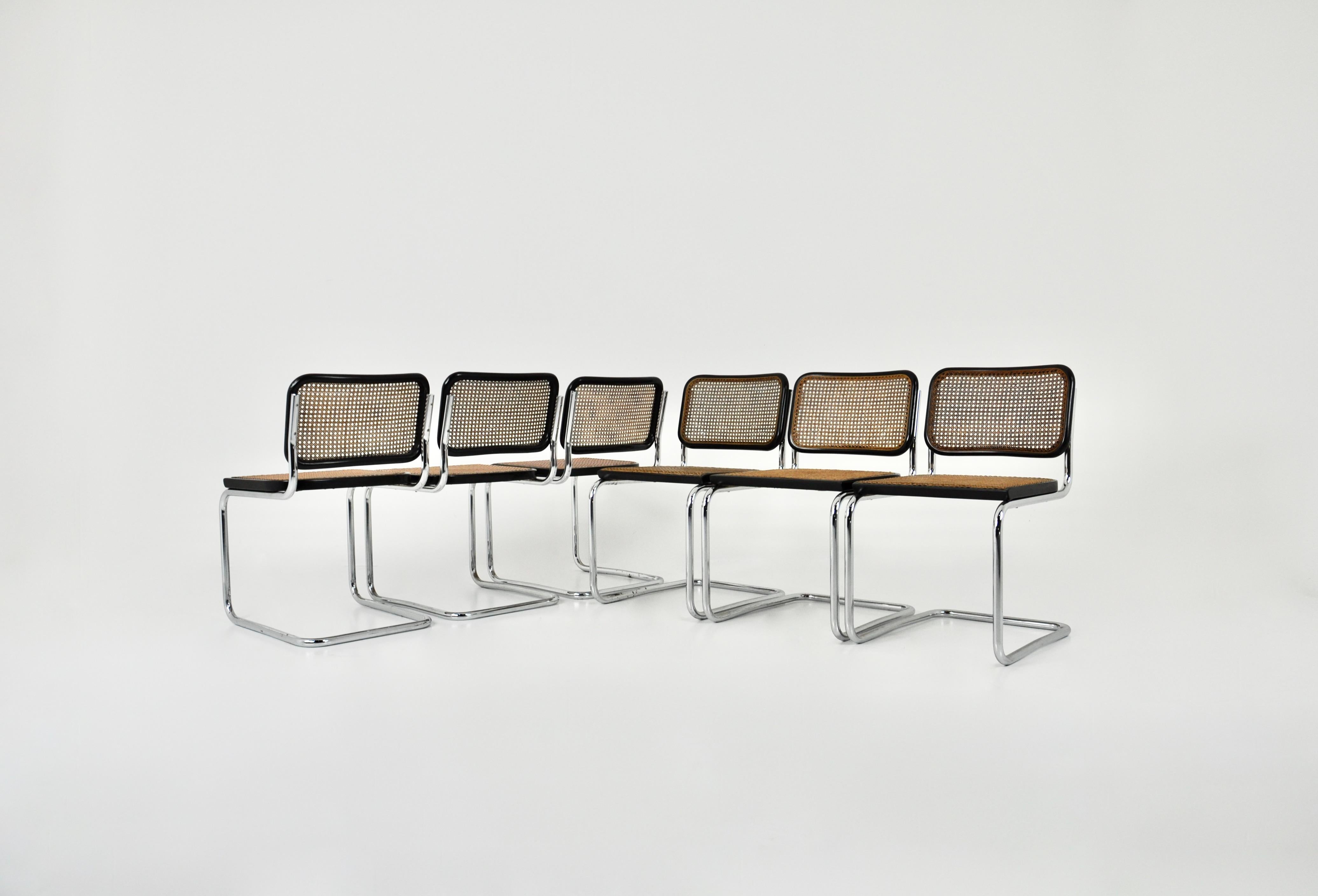 Set of 6 chairs in chromed metal, black wood and cane. Wear due to time and age of the chairs. Dimensions: seat height 46cm. Original Marcel Breuer chairs stamped Gavina.
