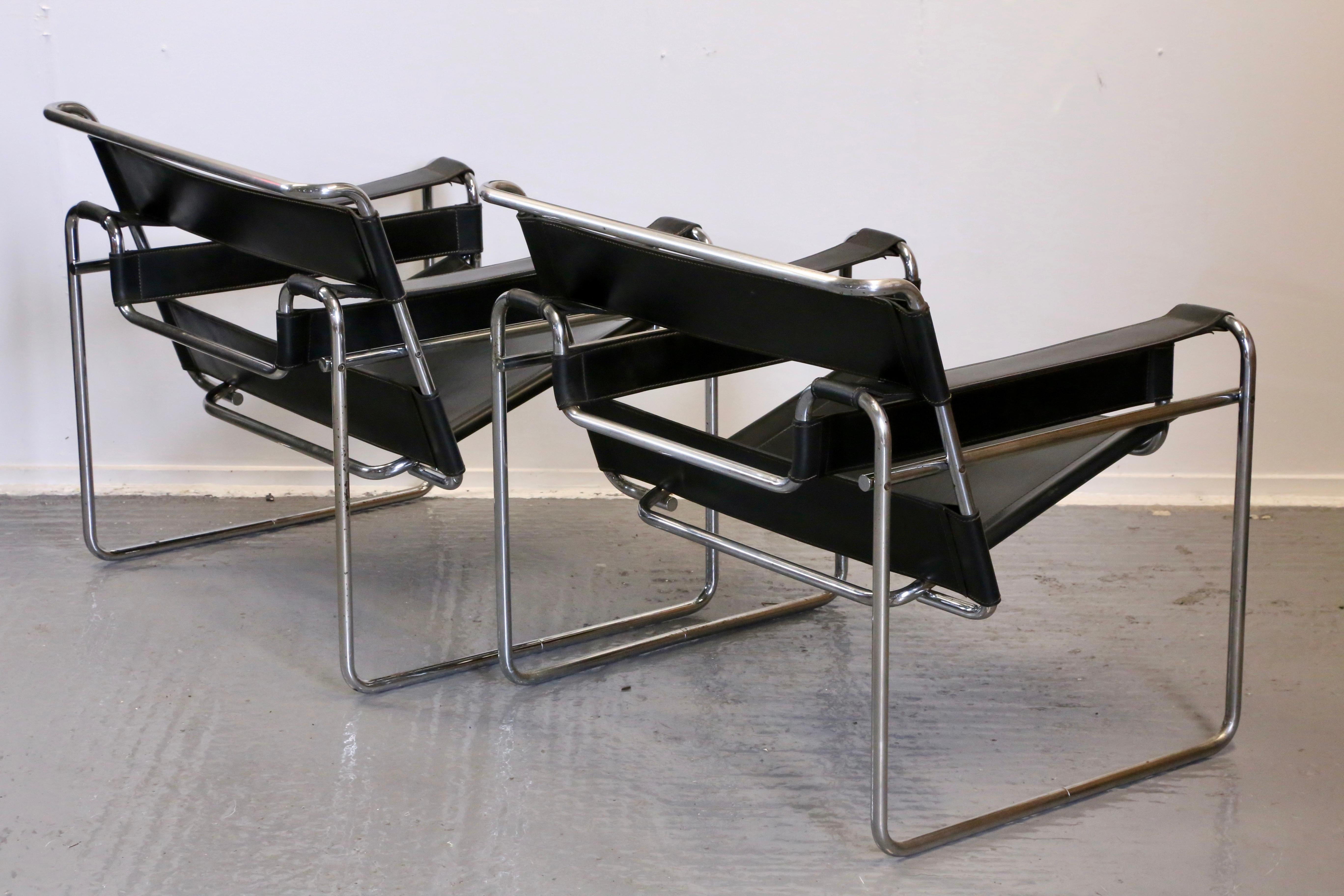 A remarkable pair of lounge armchairs, originally designed mid 1920s by Marcel Breuer as the Model B3 Wassily chair. These chairs, showing slight wear to the chrome, with pitting and rust spots, feature precision weld ends, marked bolts with all