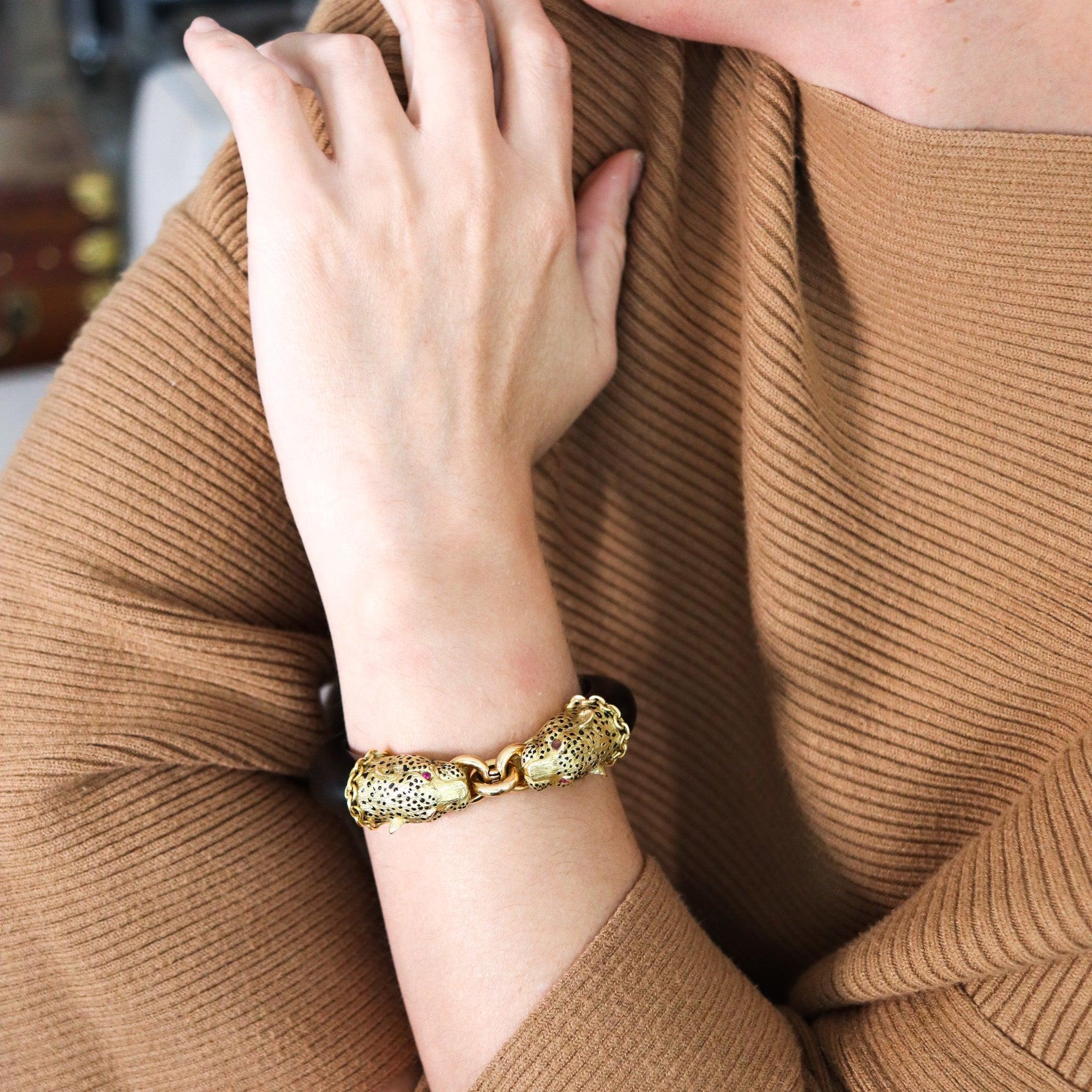 Felines bangle bracelet designed by Gay Freres.

This is a beautiful statement bracelet created in Paris France during the late mid-century modern period, back in the late 1960. This terrific bangle bracelet was crafted at the jewelry atelier of Gay