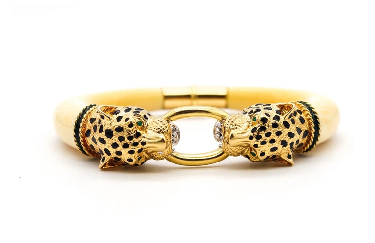 Leopards bracelet designed by Gay Freres.

Beautiful chic piece, created in Paris France, back in the 1970's. This great Leopards bangle bracelet was crafted at the jewelry atelier of Gay Freres in solid yellow gold of 18 karats and embellished with