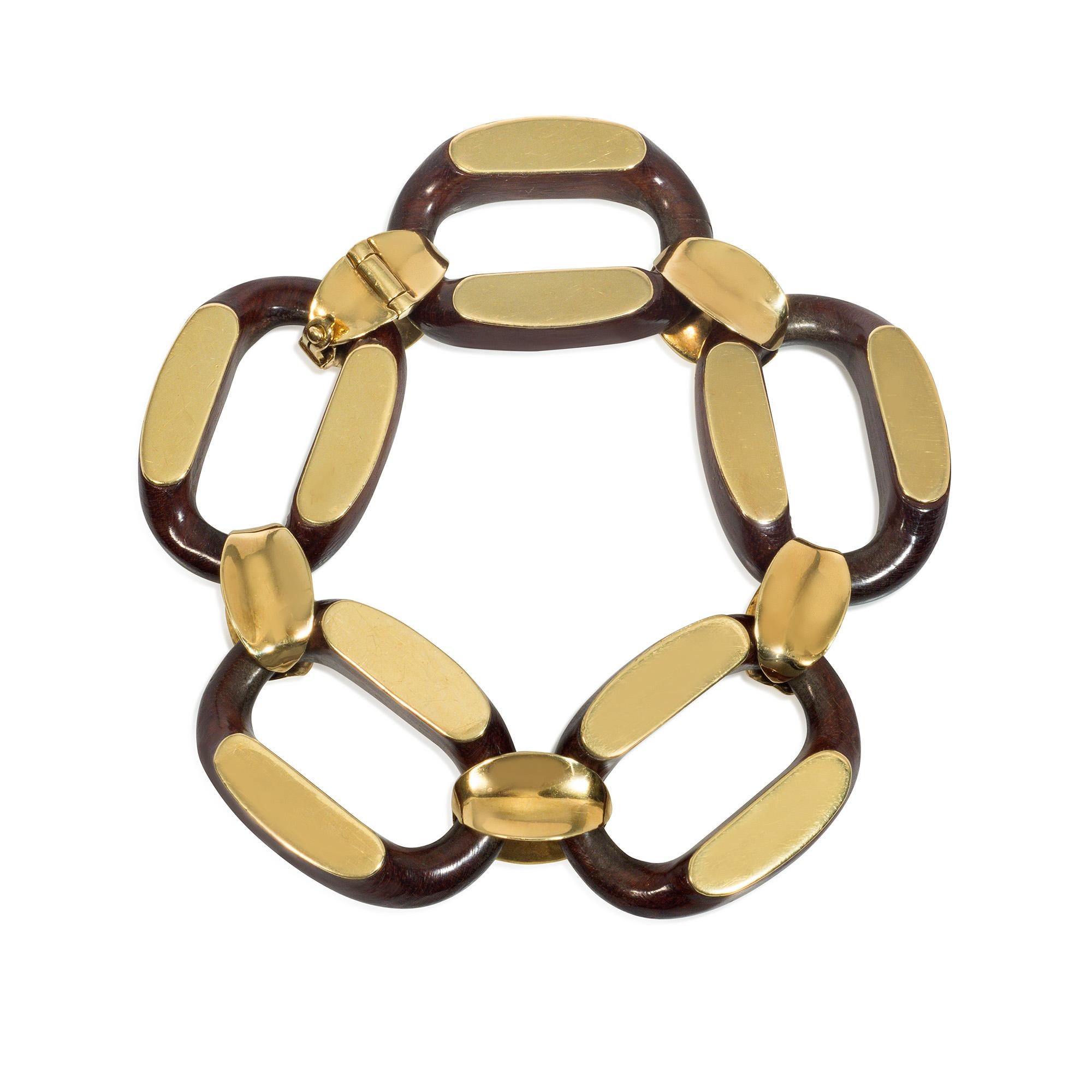 A mid-century bracelet comprised of carved oval-shaped wood and gold links with cinched gold spacers, in 18k. Gay Frères, France. 

Founded in 1835 in Geneva by Jean-Pierre Gay and Gaspard Tissot, Gay Frères were the pre-eminent makers of quality