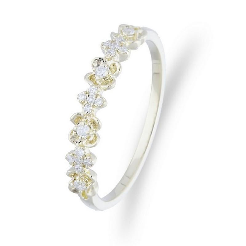 Diamond Carat Weight: This captivating ring showcases a total of 0.15 carats of round diamonds. Eleven thoughtfully chosen diamonds grace the ring, creating a delicate yet radiant sparkle.

Setting Style: The diamonds are elegantly set using a