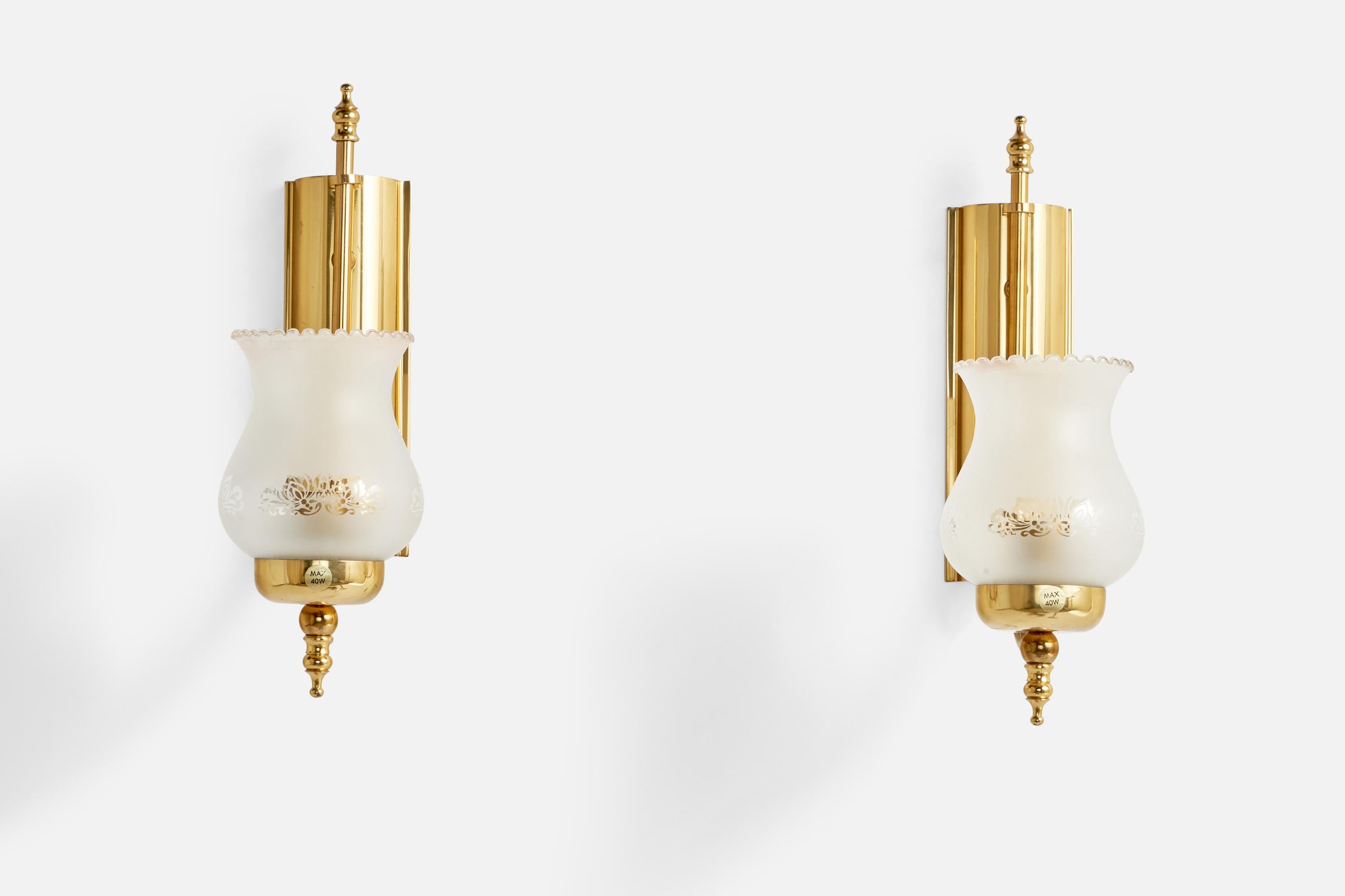 A pair of brass and etched glass wall lights designed and produced by GBW, Sweden, c. 1970s.

Overall Dimensions (inches): 12.25” H x 4” W x 8” D
Back Plate Dimensions (inches): 7.9” H x 2.65” W x 1.08” D
Bulb Specifications: E-14 Bulbs
Number of