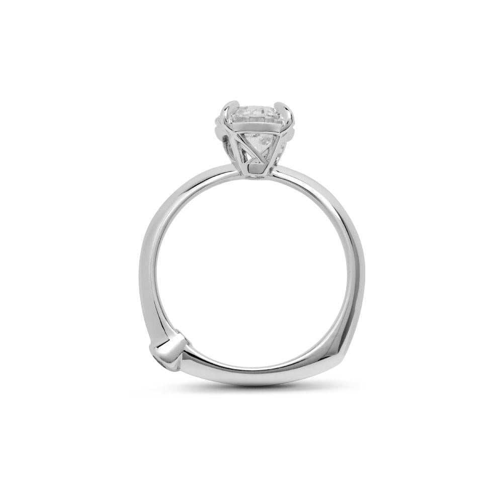 Hand-crafted to a standard of perfection, this outstanding diamond ring represents a symbol of spiritual fulfilment and love as inspired by the Goddess Viola. Cut in a classic round shape, this mesmerising centre-piece glossy diamond is sure to