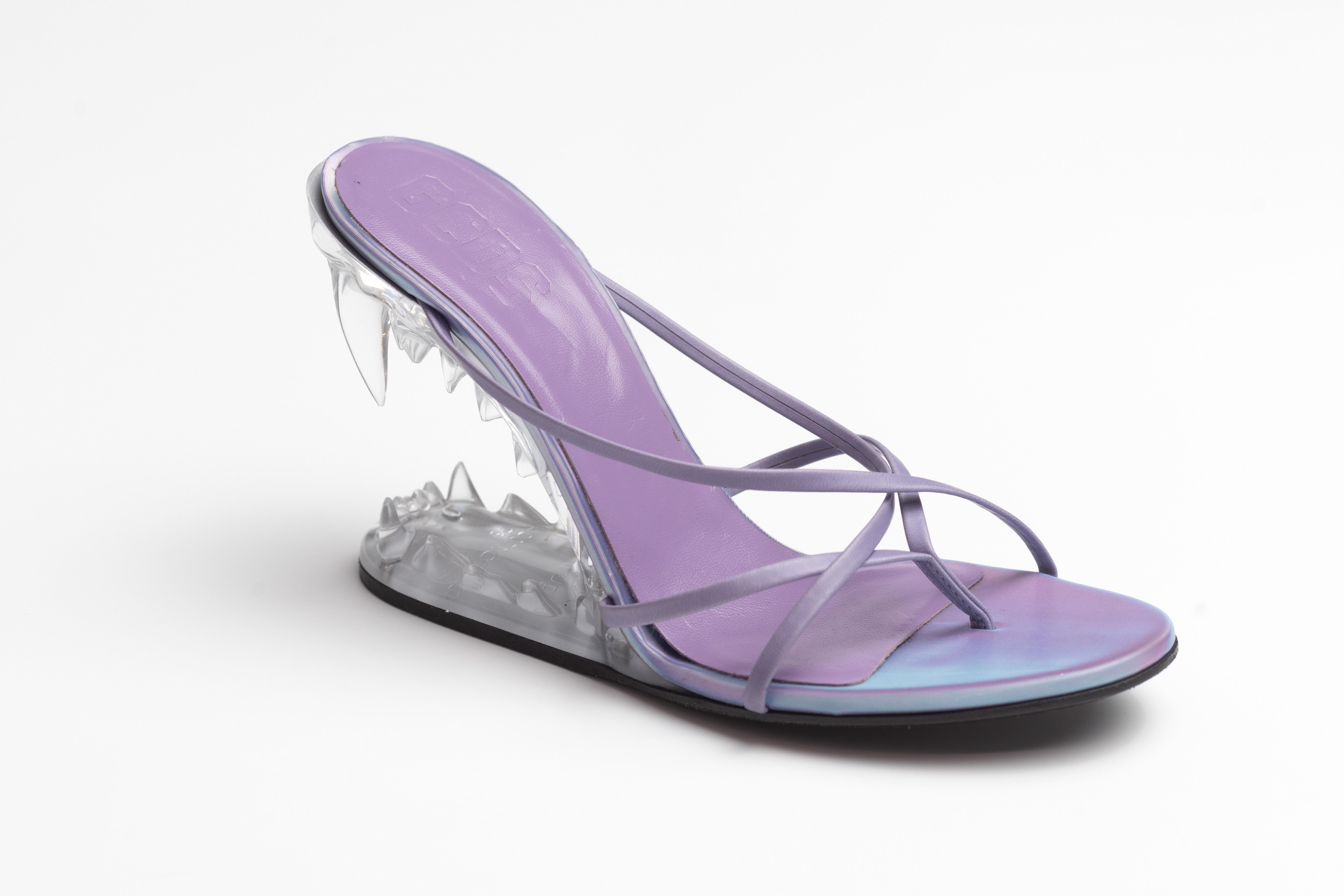 GCDS sandal with iconic matching Devour heel. Upper characterized by a mix of crossed leather straps with thong threading. Rounded tip. Lilac.

Brand: GCDS 
Composition: 80% polyester, 20% goat leather; 100% goat leather; 100% leather 
Made in: