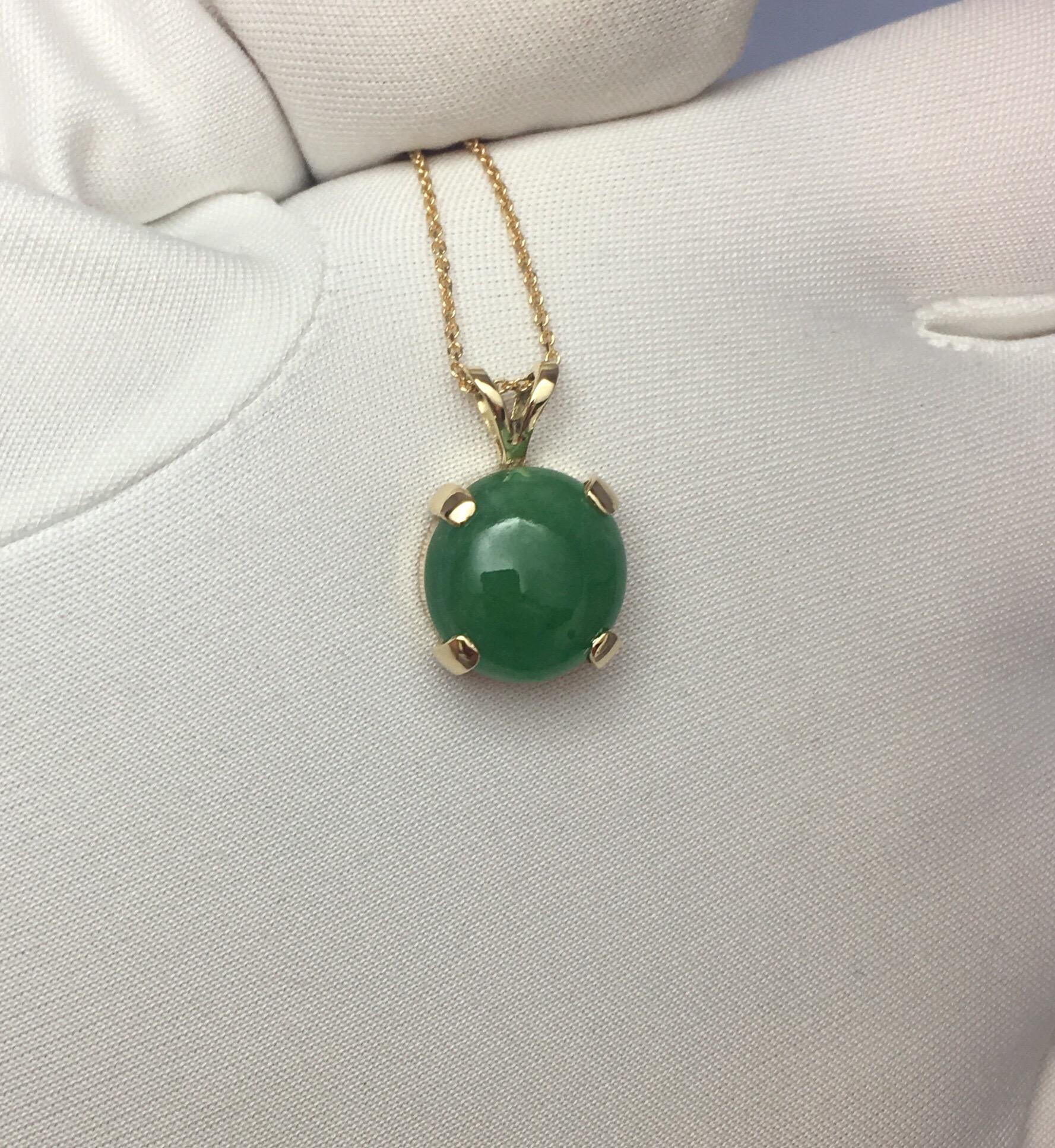 Stunning 4.90 carat untreated green jadeite jade set in a fine 14k yellow gold solitaire pendant.

Has an excellent round cabochon cut showing the colour very nicely.

Comes with GCS London Certificate confirming stone as natural and untreated.

The