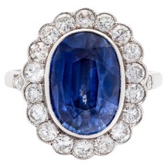 Bague certifiée GCS de 5,21 ct de saphir bleu non chauffé et de 1,00 ct de diamant en 18 K K K