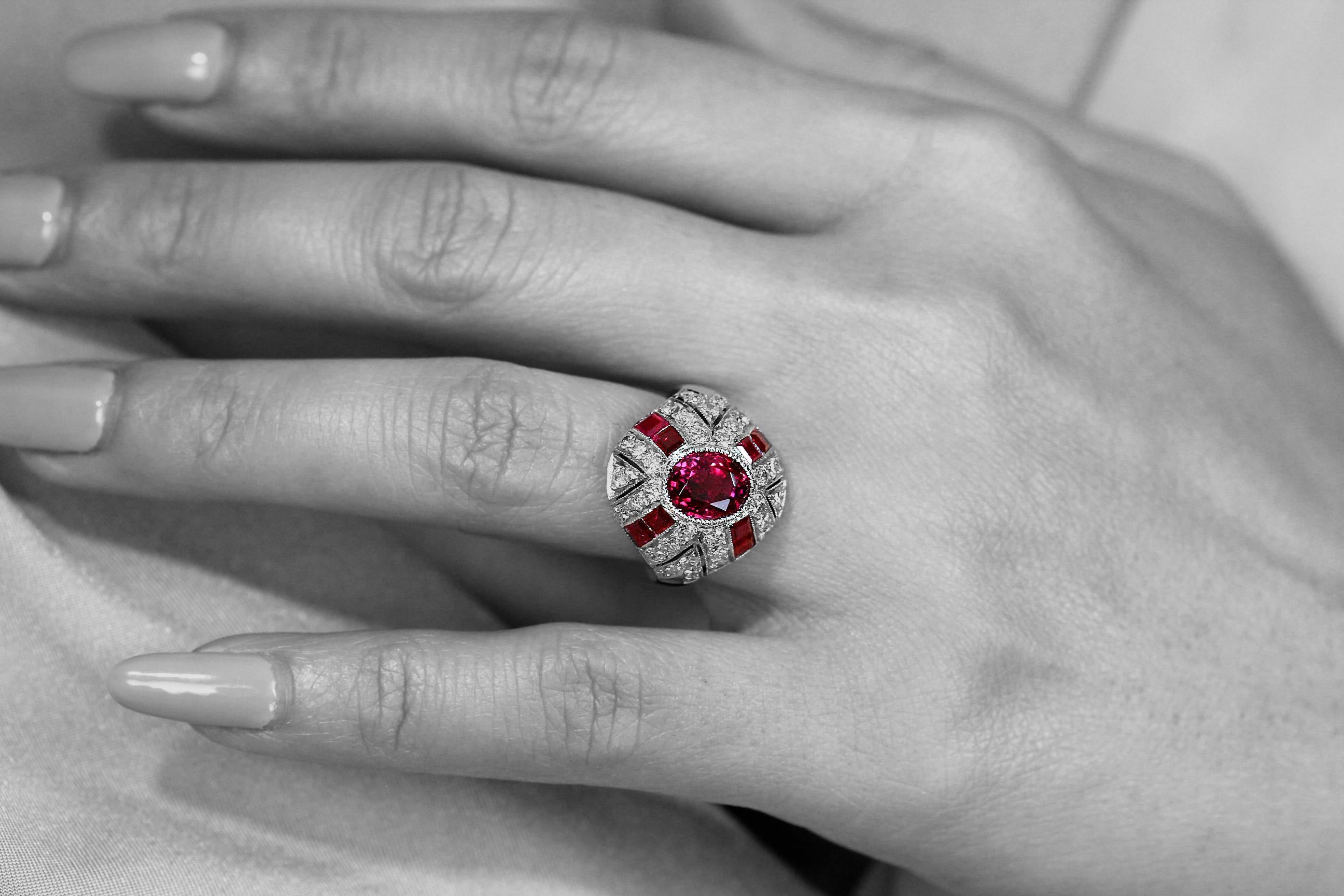 Centering blazing red ruby and from it’s four-corner, design as rubies blast out with diamonds. Handmade ring Circa 1950's, excellent quality craftsmanship set in platinum.  This ultra-rare ruby brings out the bright red color and complements the