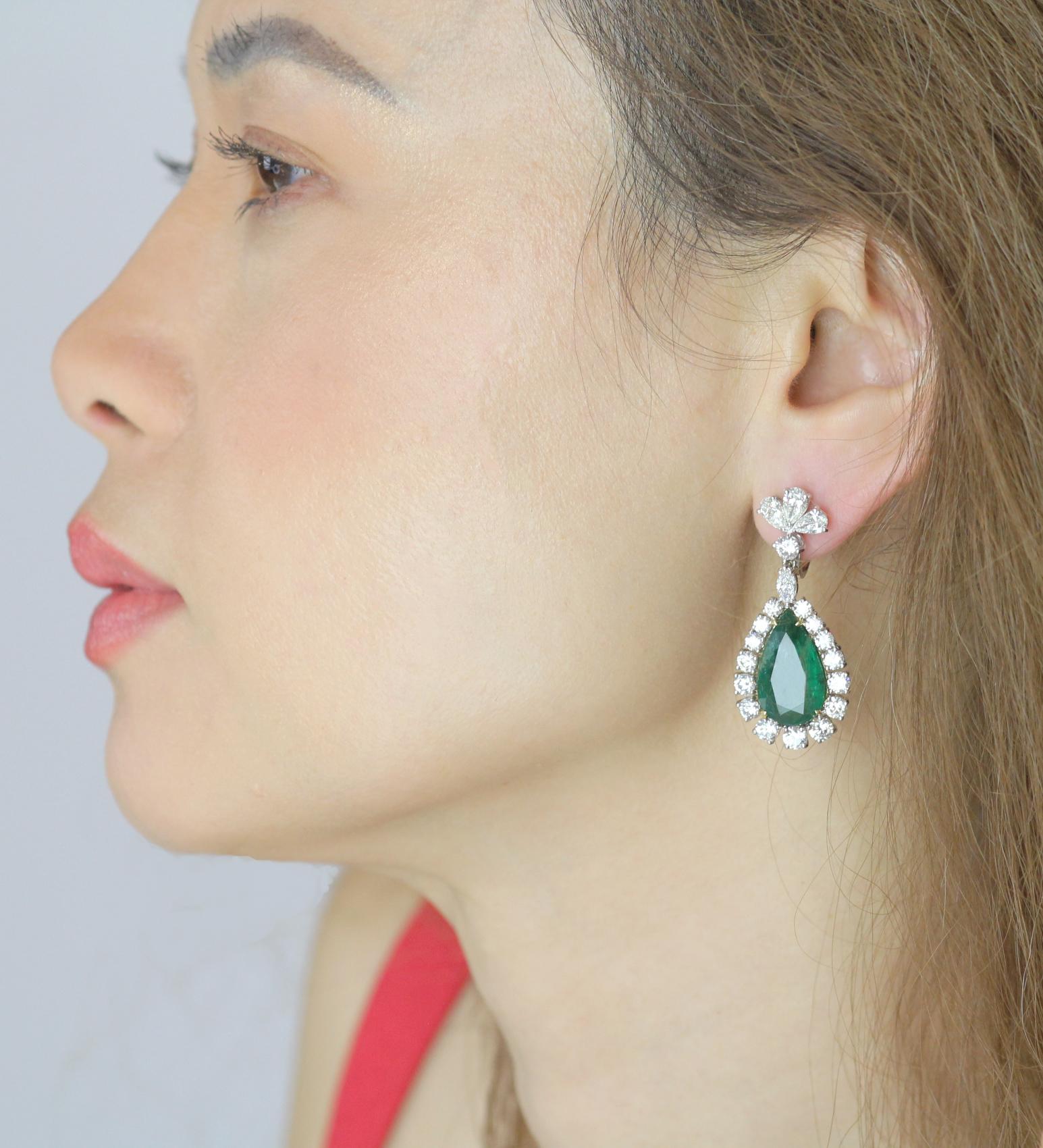 Featuring a perfectly matched pair of natural Zambian pear cut emeralds weighing a total of approximately 17.50cts, certified by the GCS gemmological laboratory.

These vibrant green emeralds have a wonderful saturation of colour and contrast with