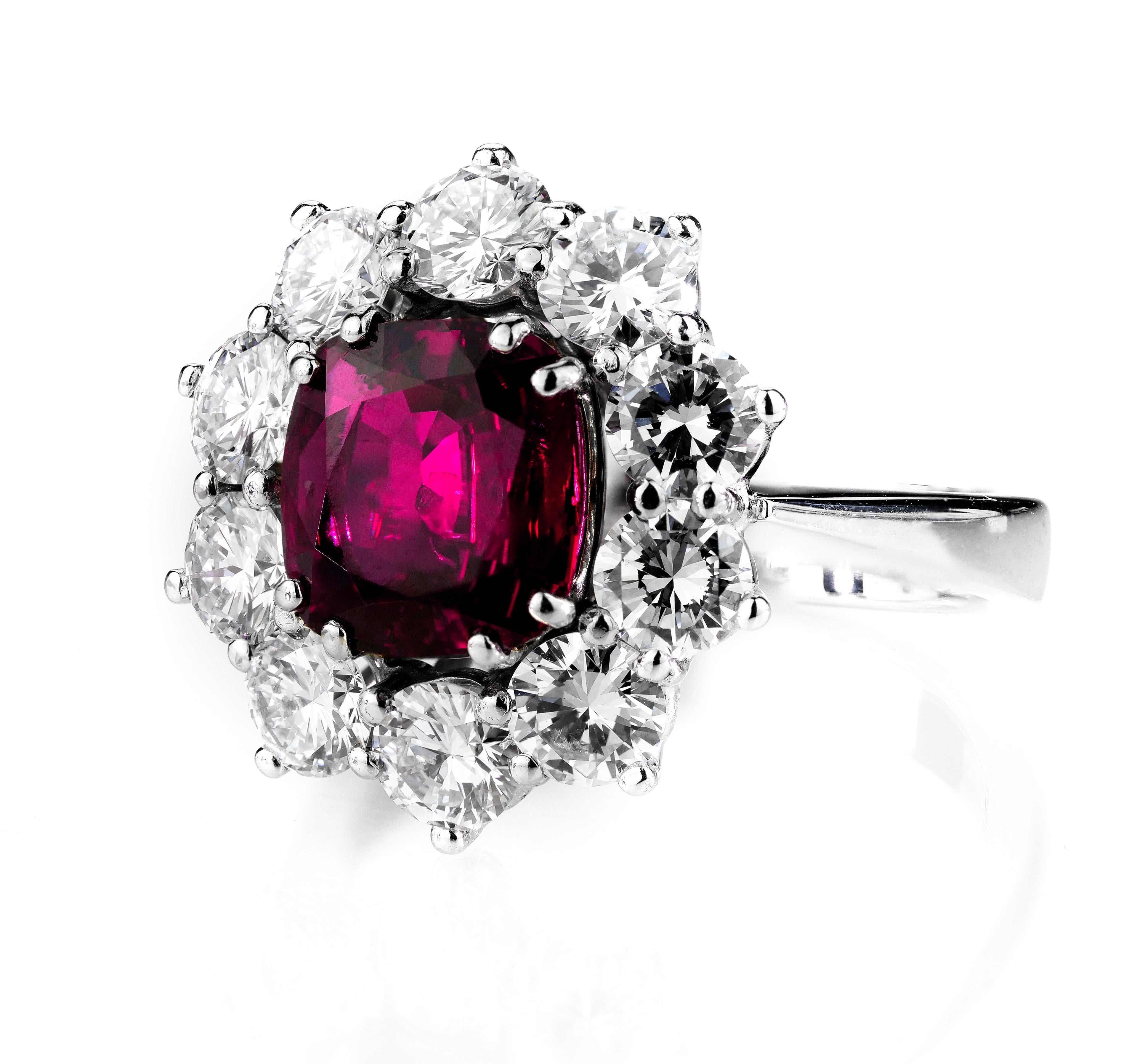 Exquisite gemstones hue of blazing ruby and cluster shining diamonds set in 18 Karat white gold. 
Ruby – widely celebrated as the most important gemstone in the world – is a once in a lifetime discovery. Effortlessly complemented by round brilliant