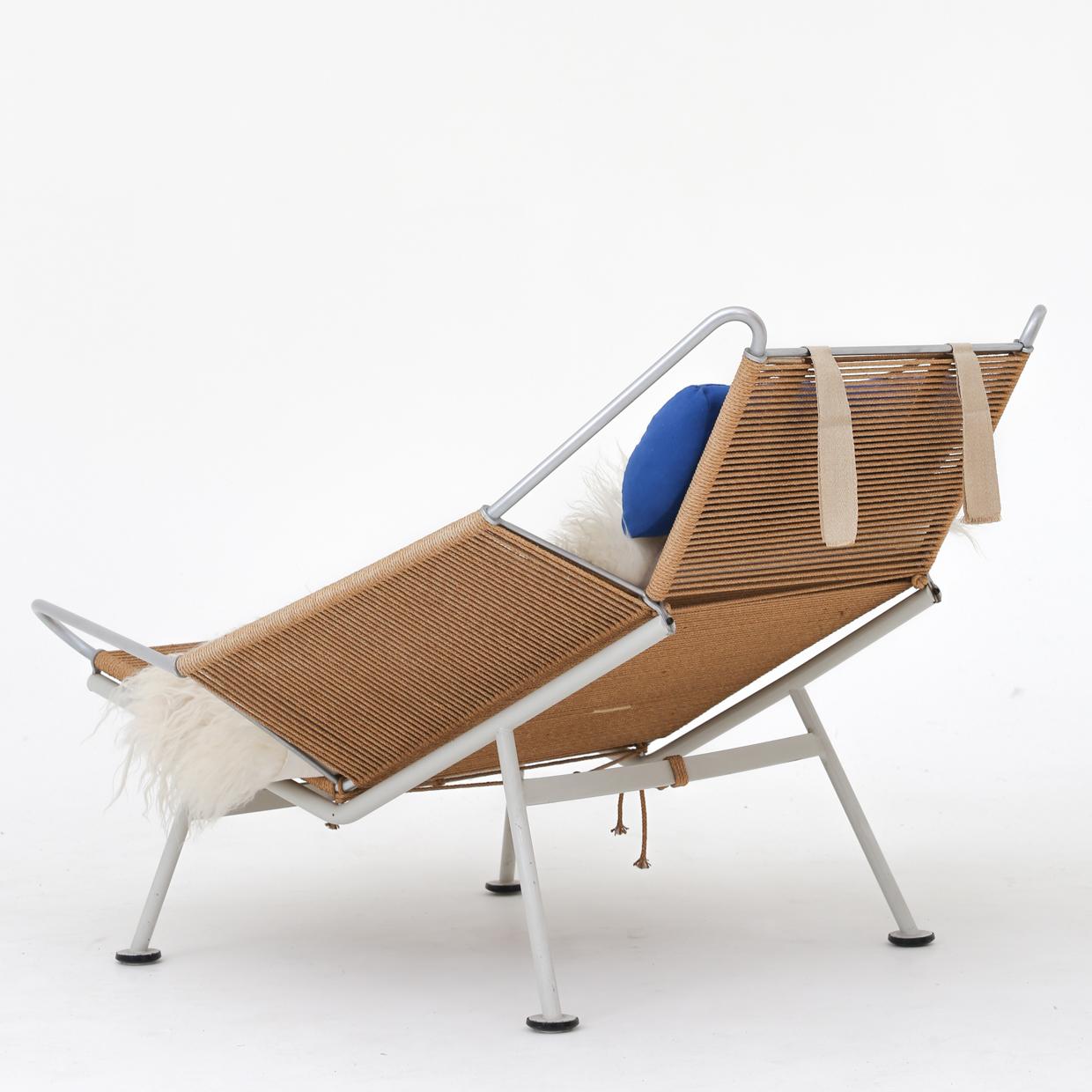 GE 225 - Early 'Flag Halyard Chair' with original white lacquered steel frame and patinated flagline with blue cushion. Designed in 1950. Maker Getama.