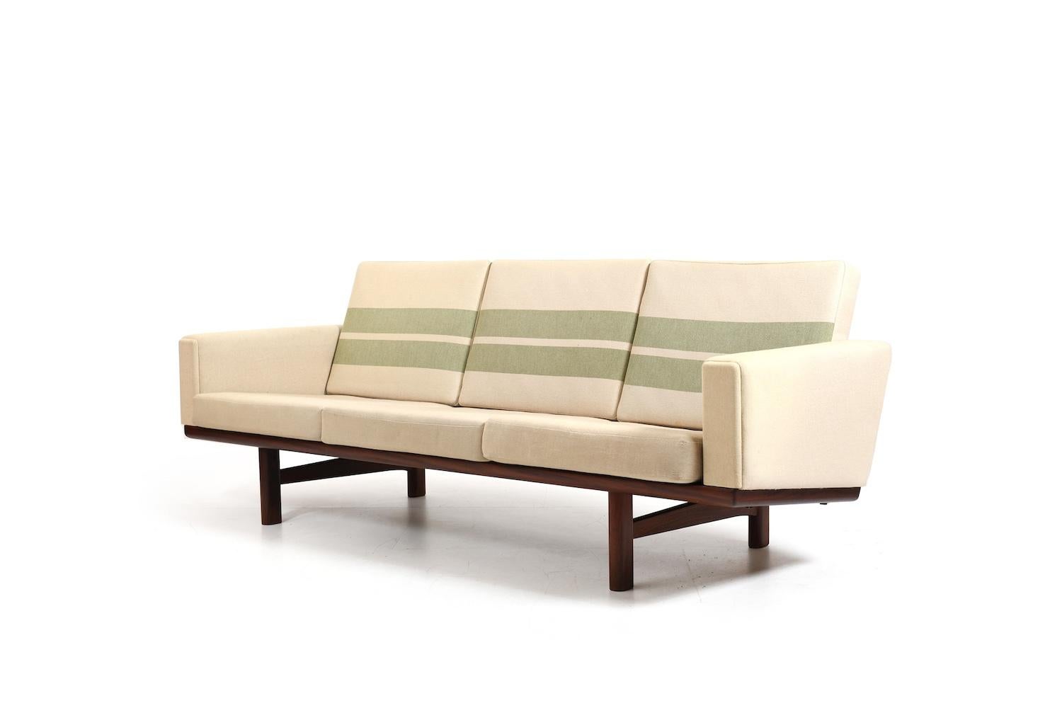 GE-236 / 3 sofa in solid teak, designed by Hans J. Wegner in 1955. Manufactured by Getama in 1960s. Original cushions in creme / green stripes wool fabric,
