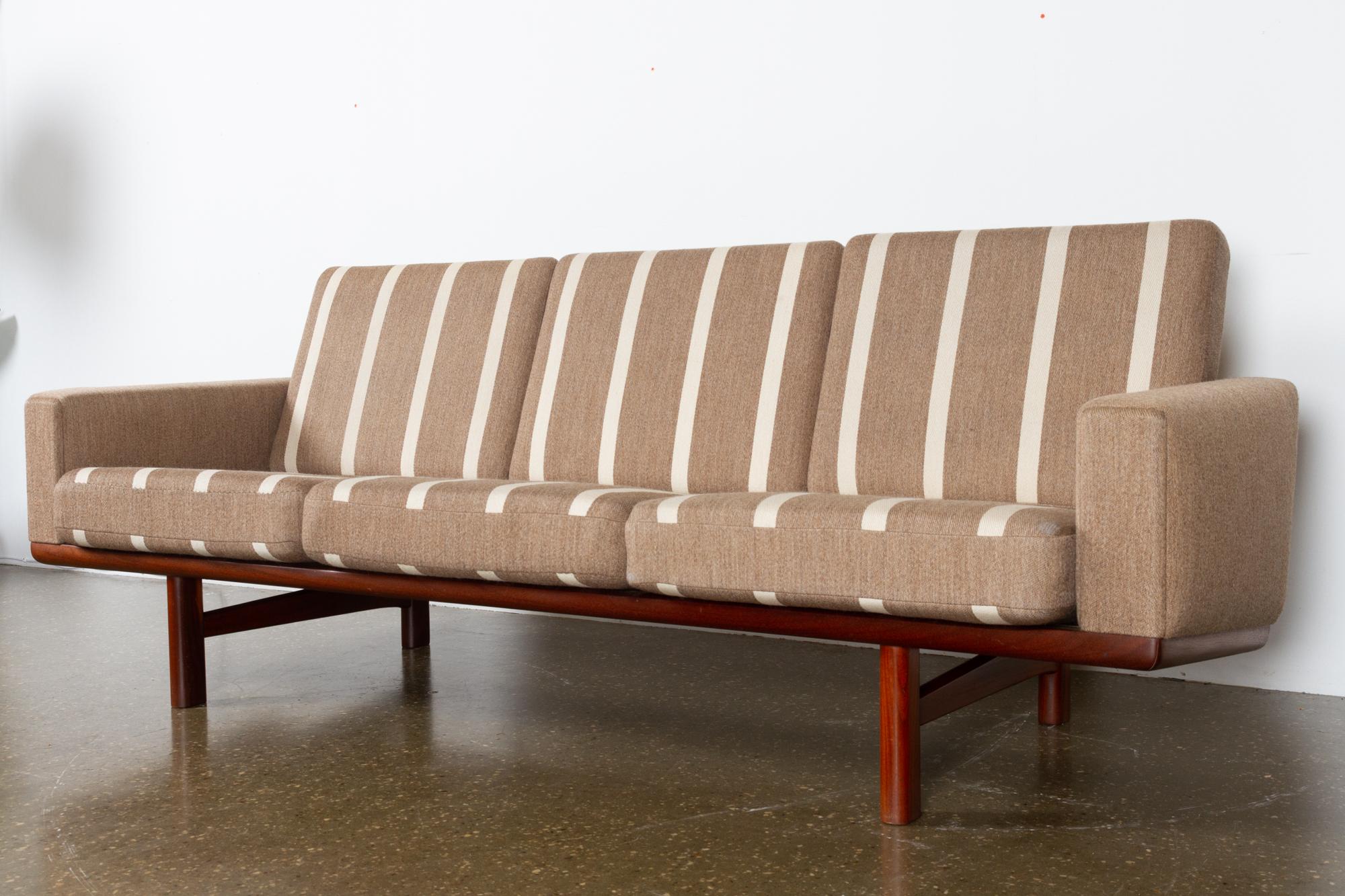 GE-236 three-seat sofa by Hans J. Wegner for GETAMA, 1960s
Danish Mid-Century Modern Minimalist sofa in teak. Model GE 236 was designed by Hans J. Wegner in 1955. Being a three-seater this sofa has the model number GE236/3. Excellent high quality