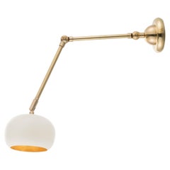 Gea brass wall light with jointed arm